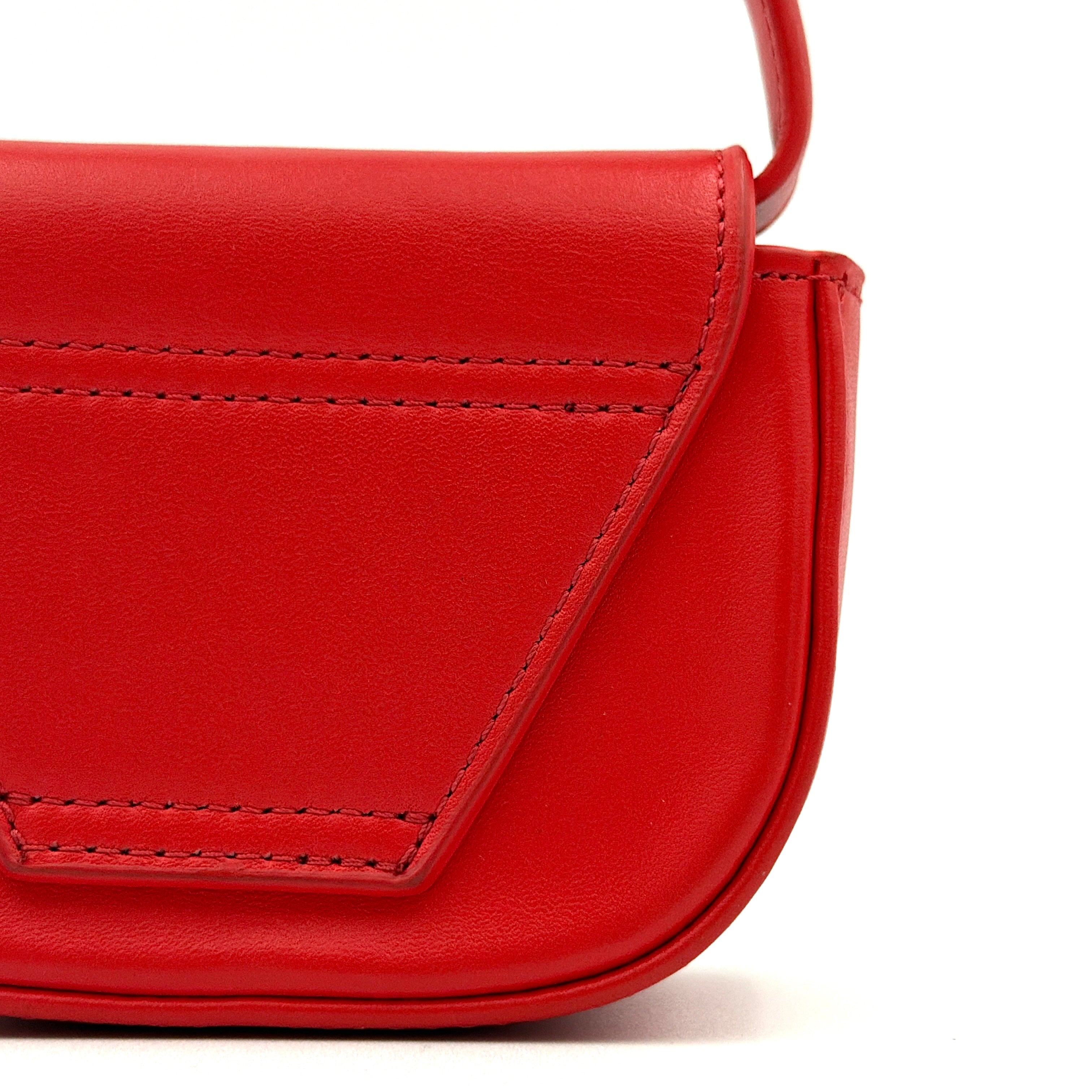 Diesel 2Way 1DR-XS Mini Bag in striking red leather with bold silver D logo, paired with a detachable matching strap.