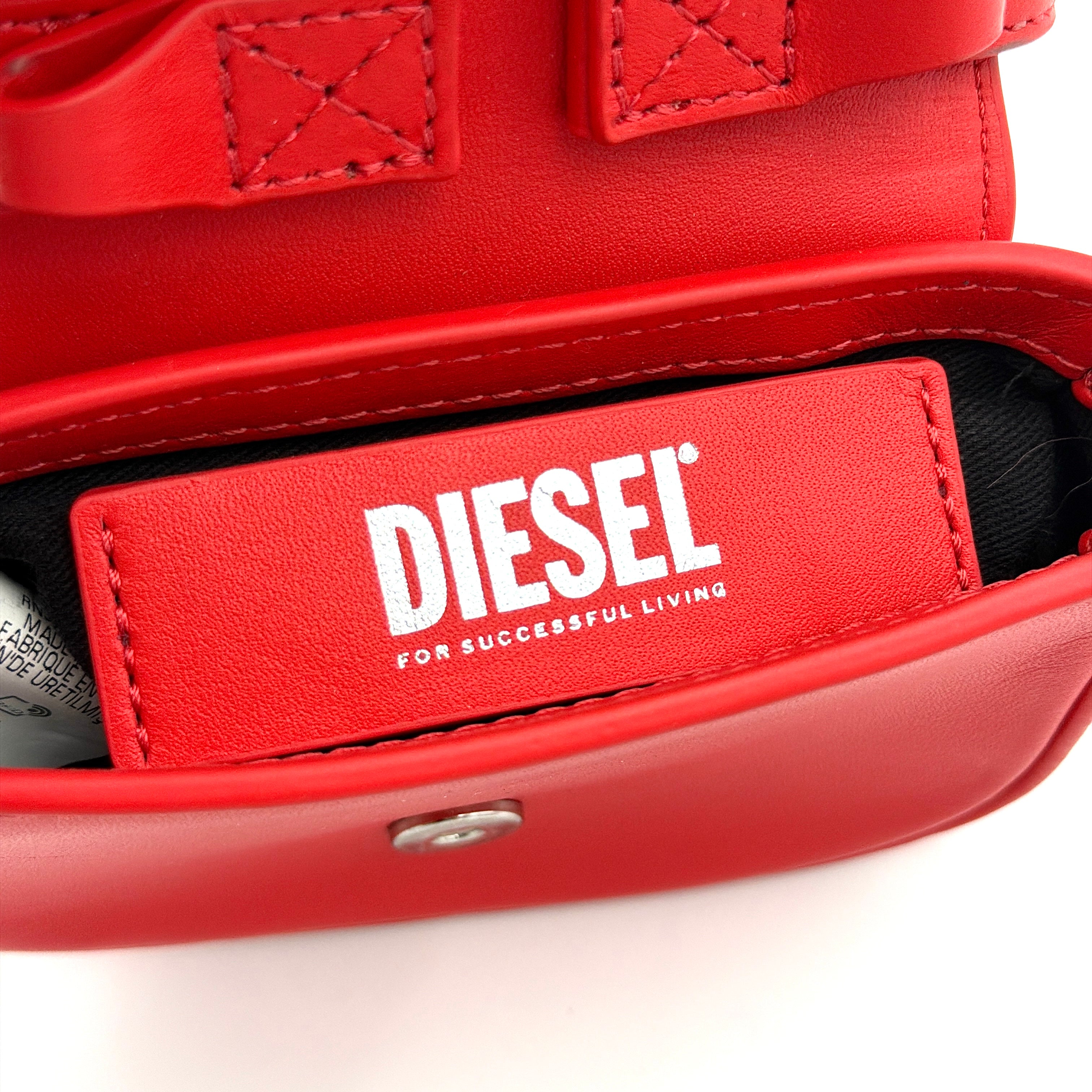 Diesel 2Way 1DR-XS Mini Bag in striking red leather with bold silver D logo, paired with a detachable matching strap.