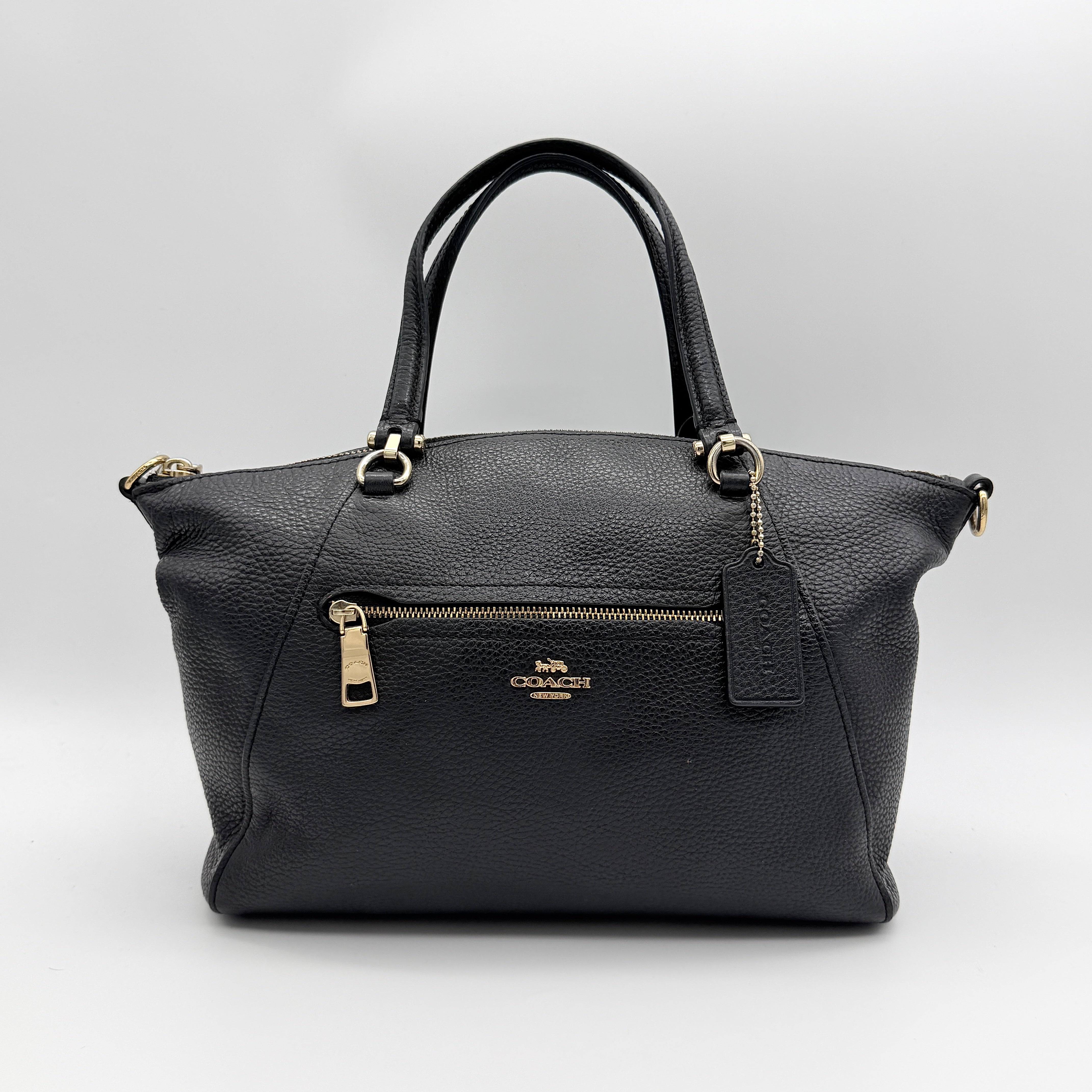 Coach 2Way Prairie Satchel in black grained leather with gold-tone hardware, shown with detachable strap and branded dust bag.
