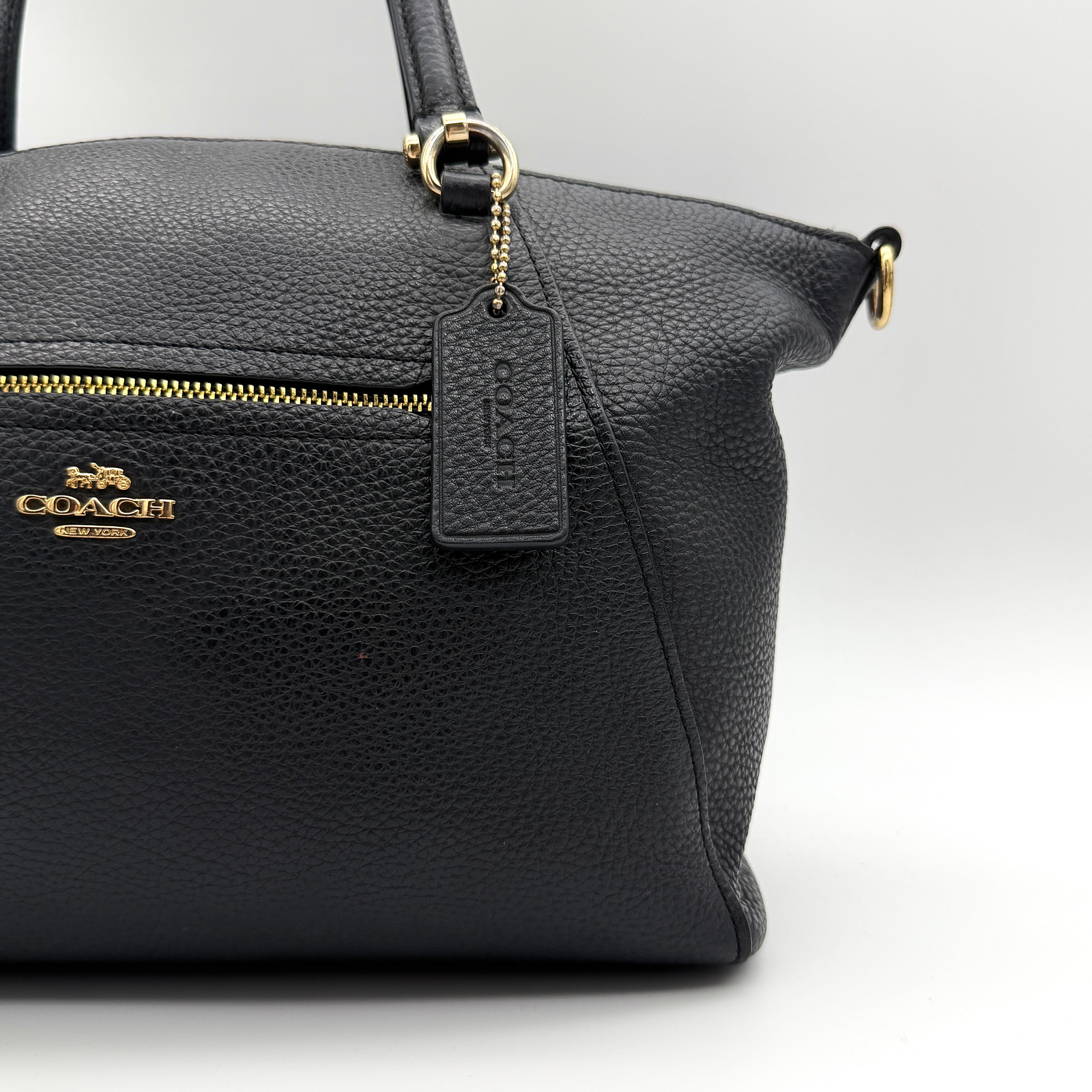 Coach 2Way Prairie Satchel in black grained leather with gold-tone hardware, shown with detachable strap and branded dust bag.