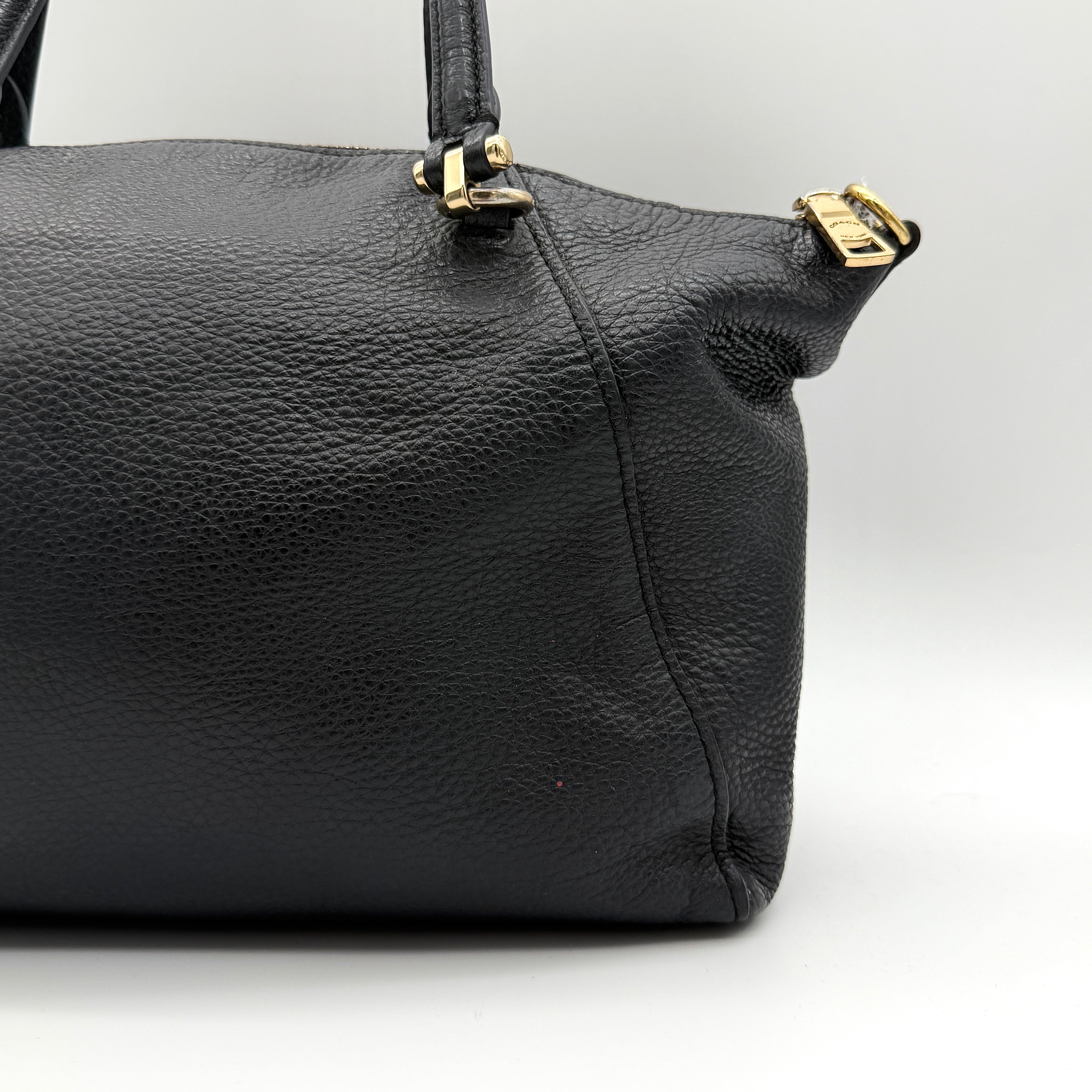 Coach 2Way Prairie Satchel in black grained leather with gold-tone hardware, shown with detachable strap and branded dust bag.