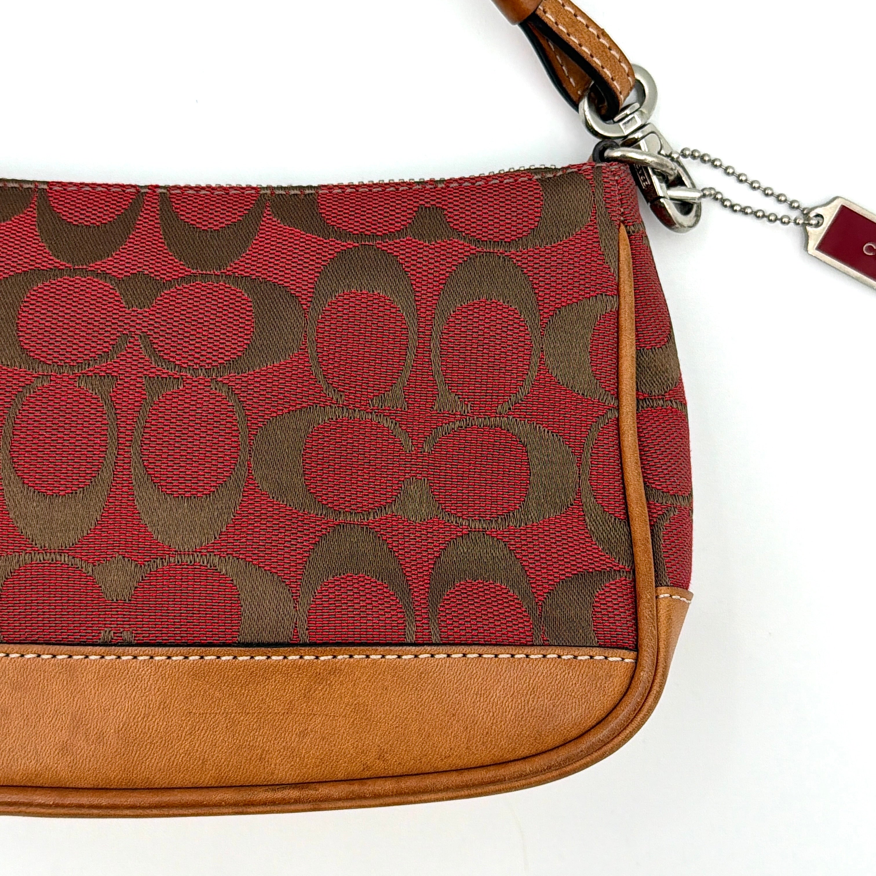 Coach Y2K Demi Shoulder Bag in red jacquard canvas with tan leather trim and silver-tone hardware, featuring a signature enamel Coach hangtag.