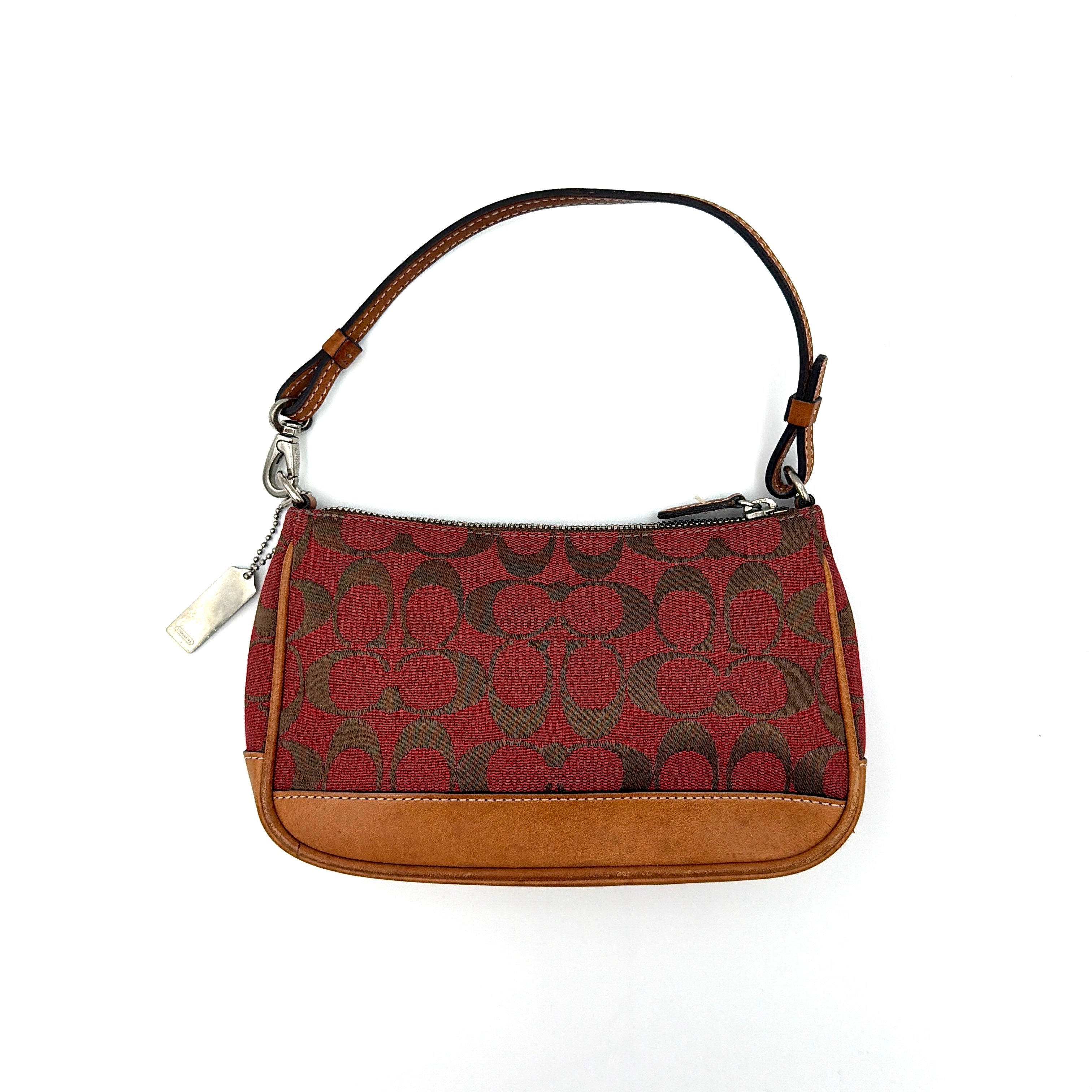 Coach Y2K Demi Shoulder Bag in red jacquard canvas with tan leather trim and silver-tone hardware, featuring a signature enamel Coach hangtag.