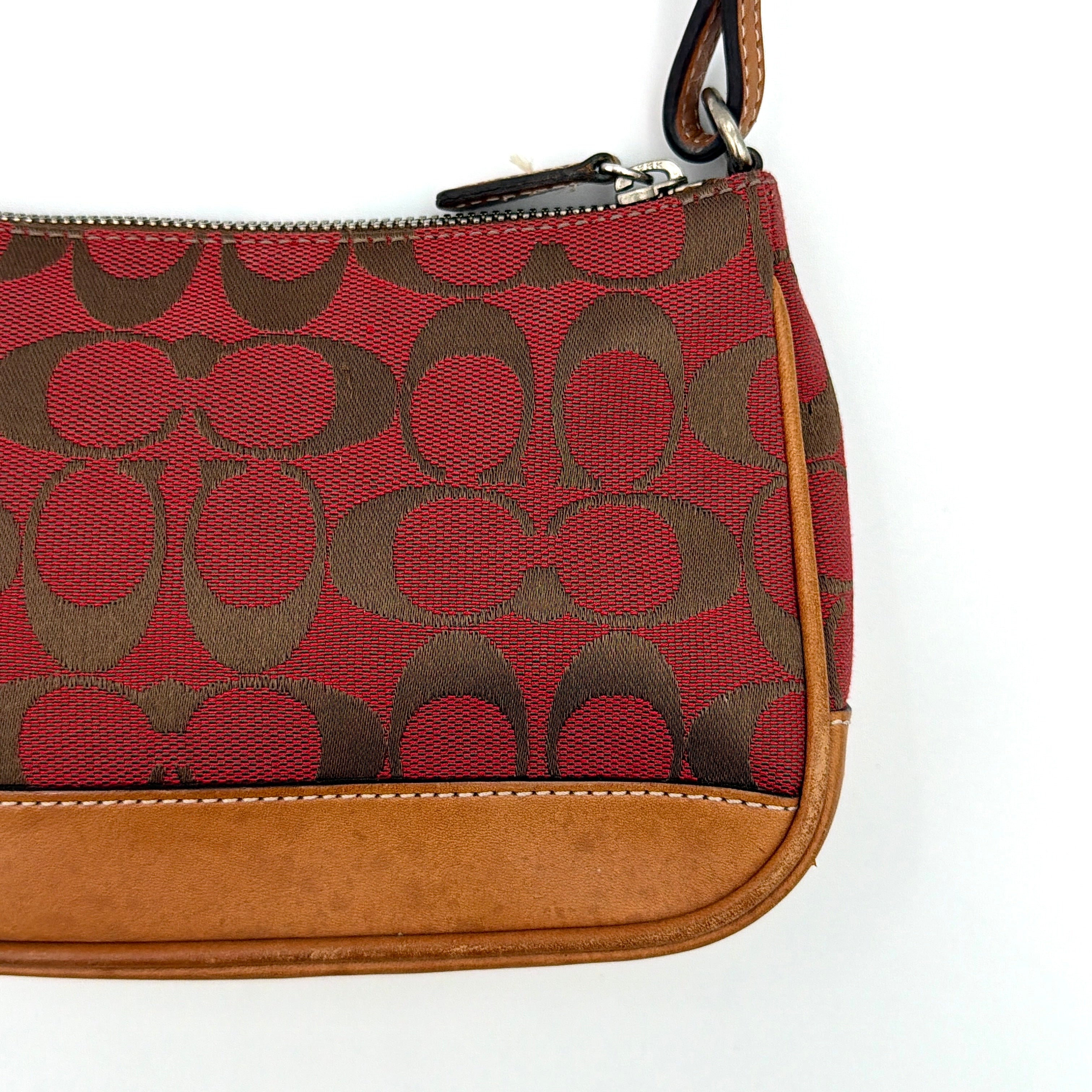 Coach Y2K Demi Shoulder Bag in red jacquard canvas with tan leather trim and silver-tone hardware, featuring a signature enamel Coach hangtag.