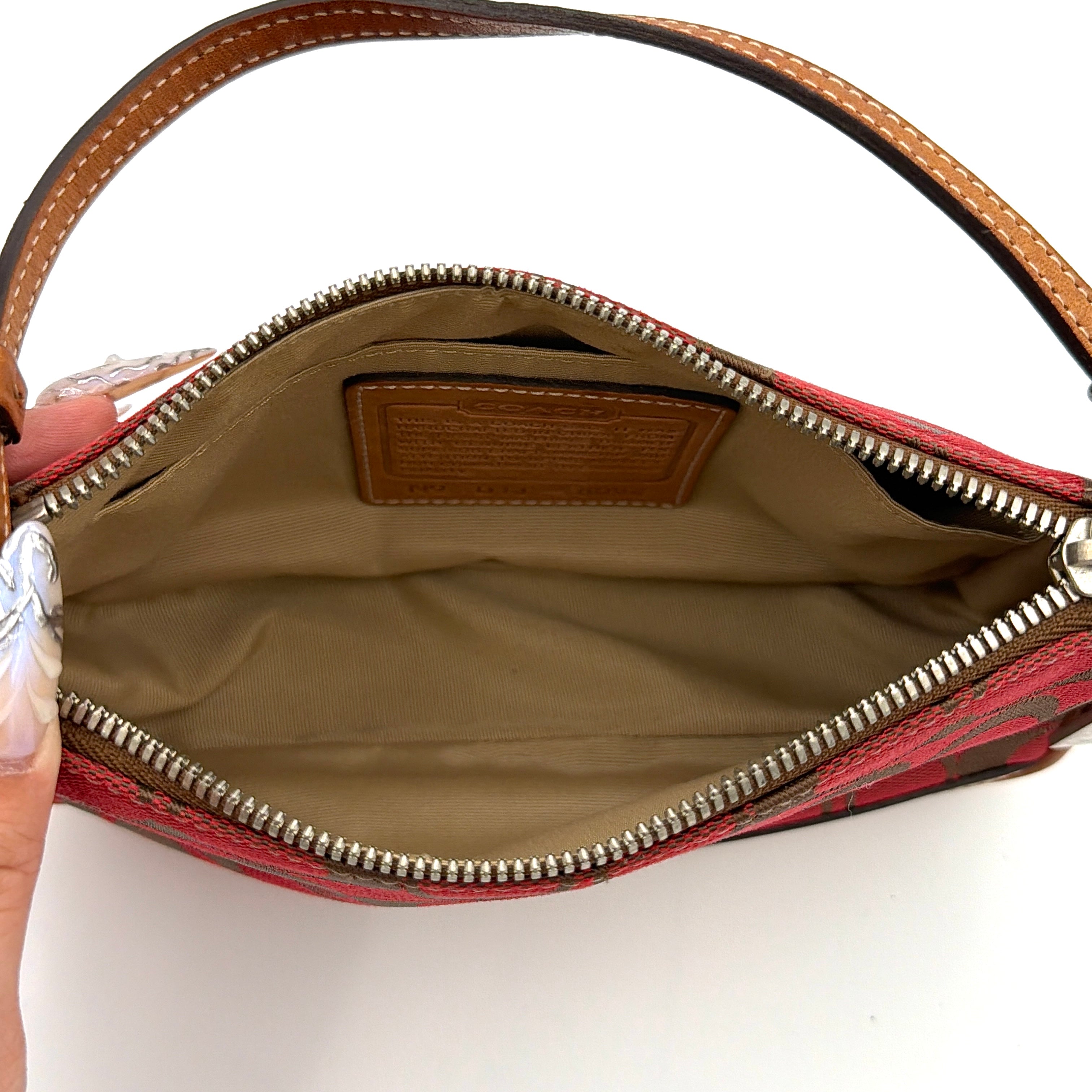 Coach Y2K Demi Shoulder Bag in red jacquard canvas with tan leather trim and silver-tone hardware, featuring a signature enamel Coach hangtag.
