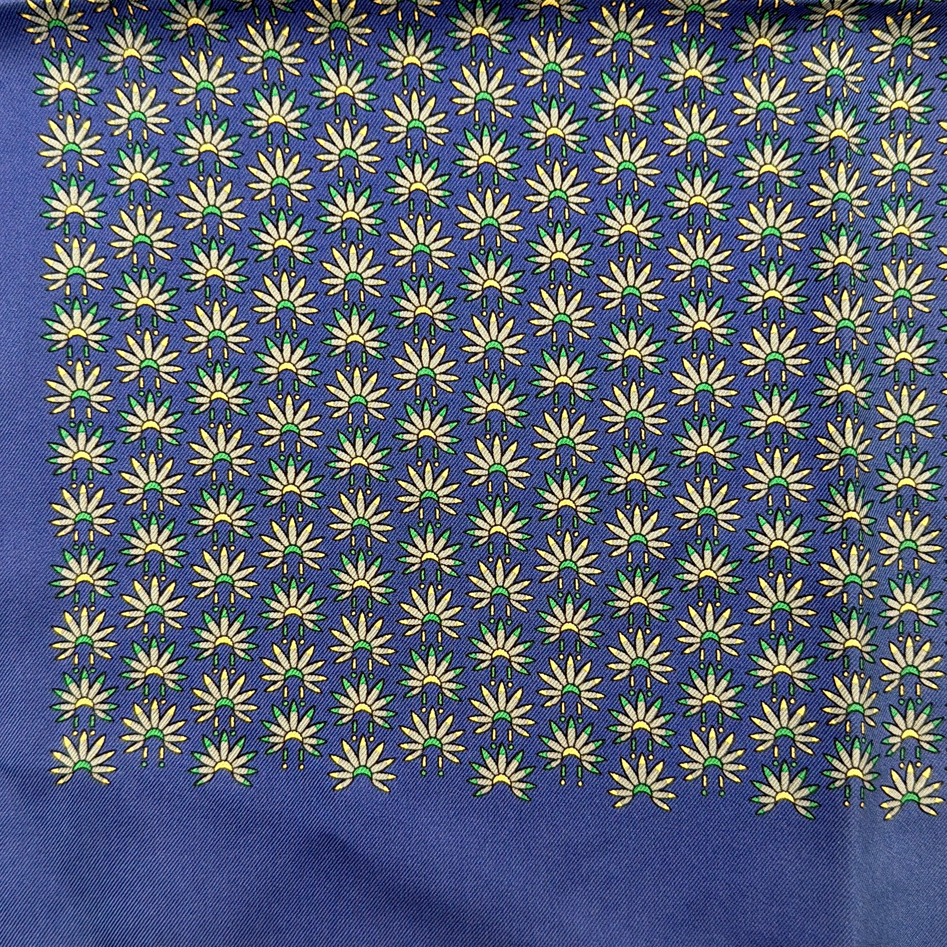 Hermès silk scarf in vibrant blue, featuring a precise all-over floral pattern and hand-rolled edges.