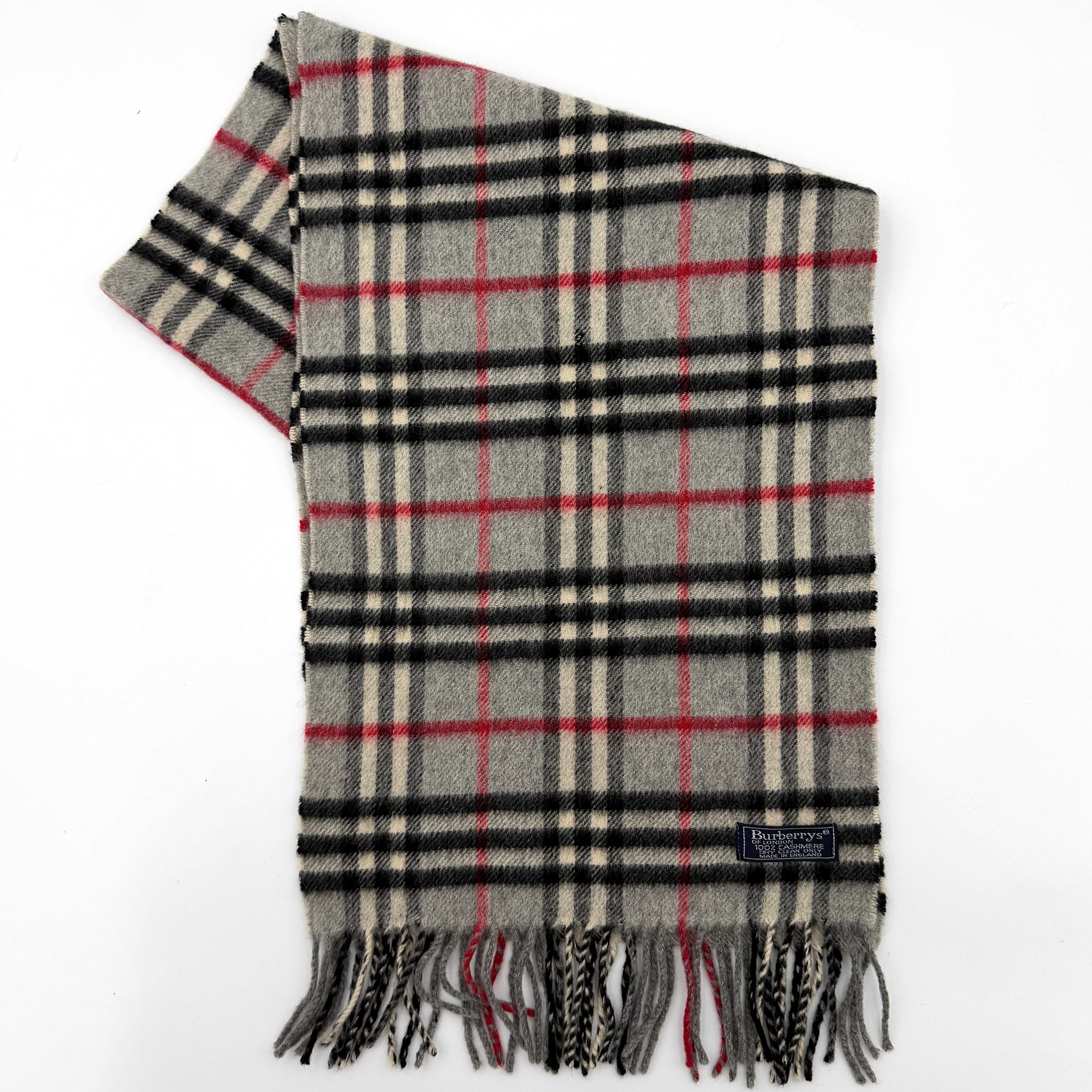 Burberry London scarf in grey cashmere with signature Nova Check pattern and twisted fringe detailing.