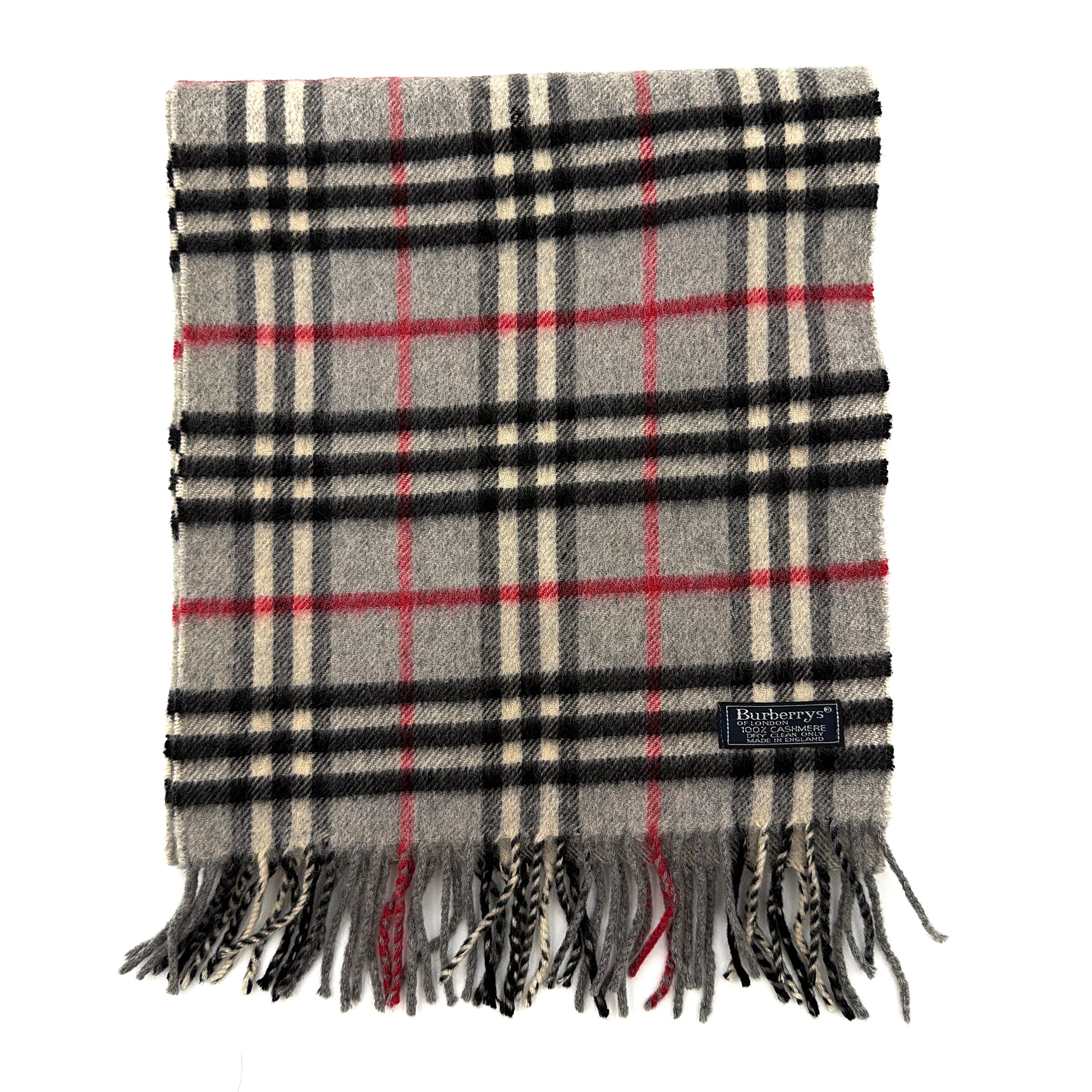 Burberry London scarf in grey cashmere with signature Nova Check pattern and twisted fringe detailing.