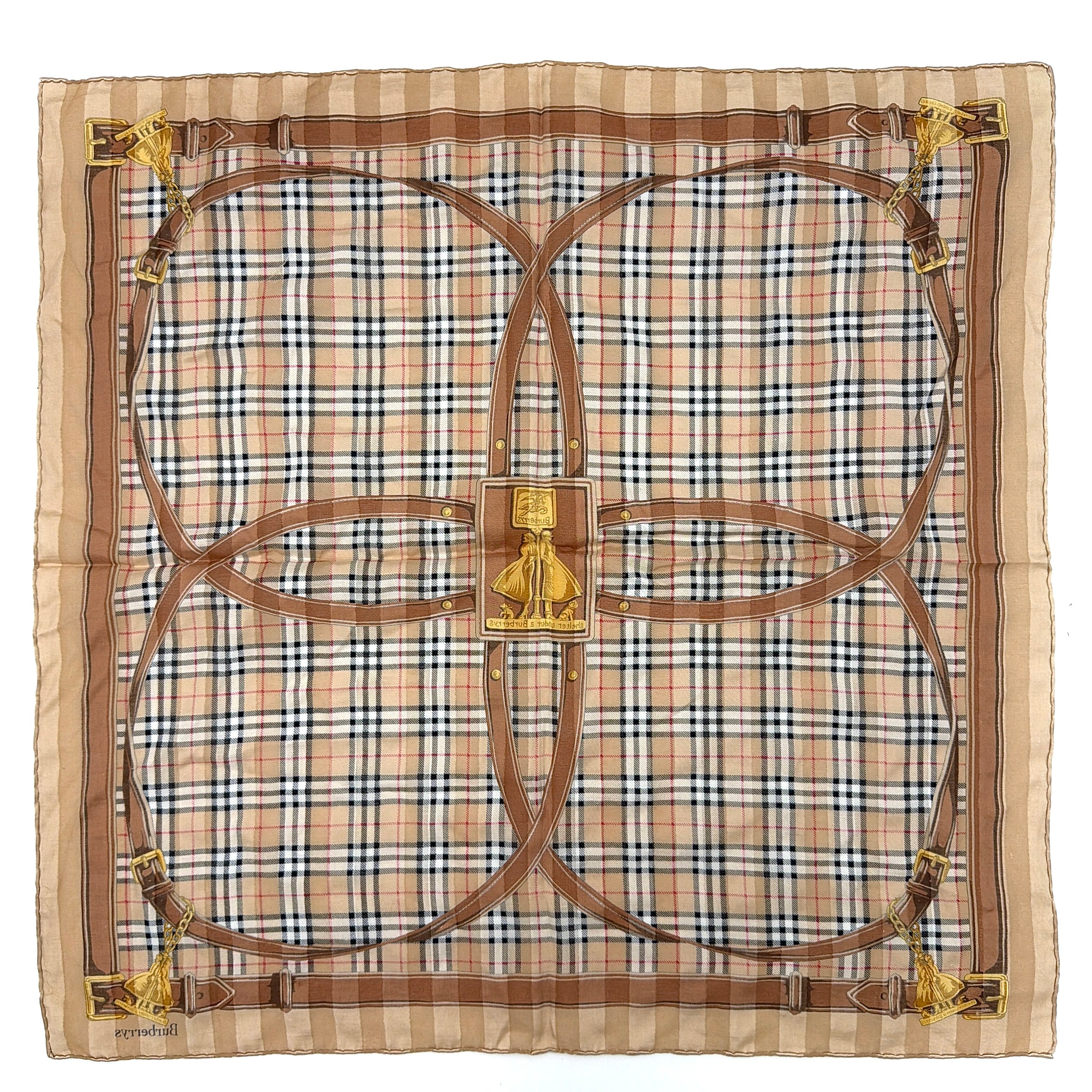 Editorial image of a Burberry silk bandana featuring Nova Check and equestrian-inspired harness motif in beige and gold tones.
