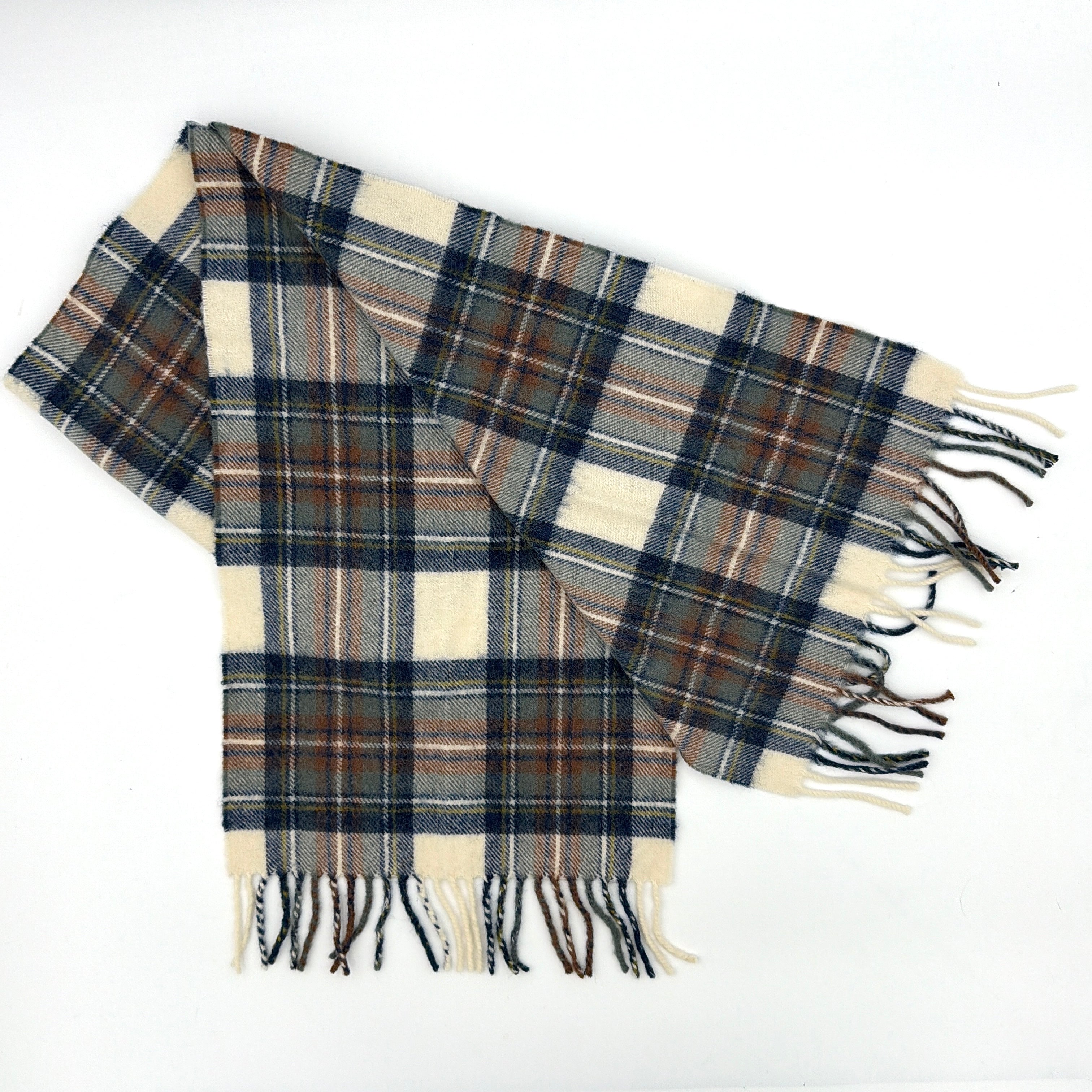 Burberry wool scarf in a muted blue, cream, and grey Stewart tartan, finished with long fringe and a woven heritage label.