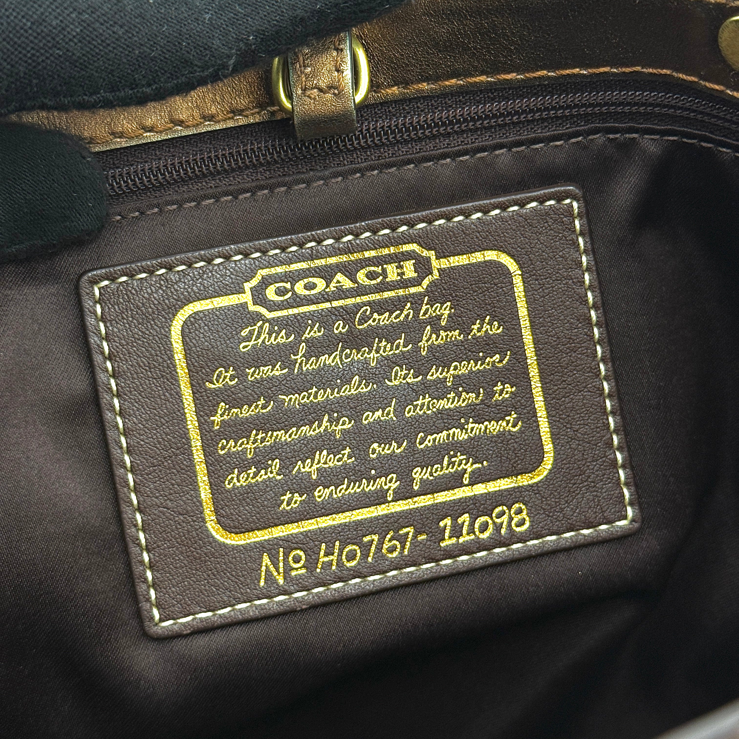 Coach Signature Stripe Tote Bag in rich brown monogram canvas with metallic gold leather handles, photographed upright against a clean background.