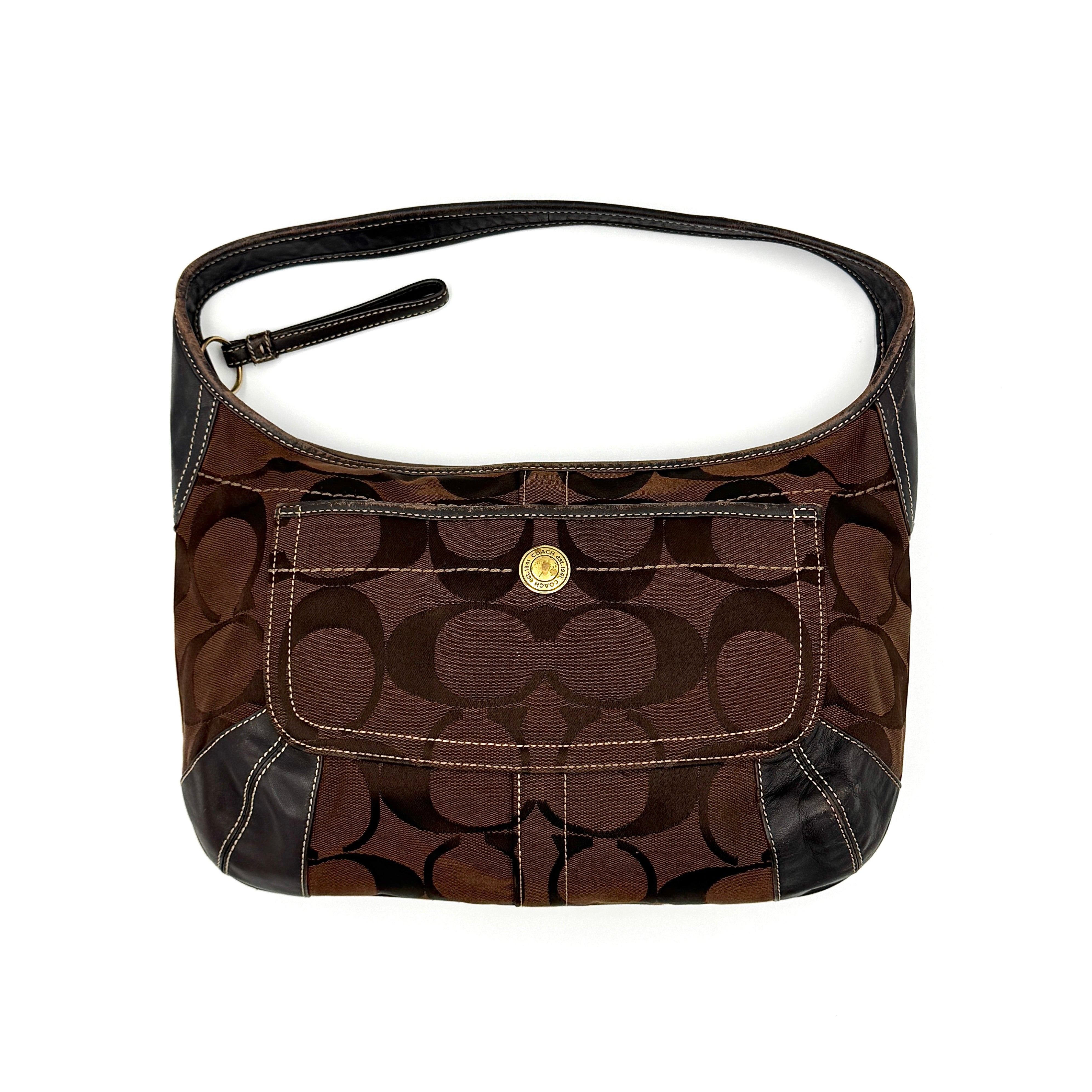 Coach Signature Ergo Hobo Shoulder Bag in brown monogram canvas with dark leather trim and gold-tone hardware, shown from the front.
