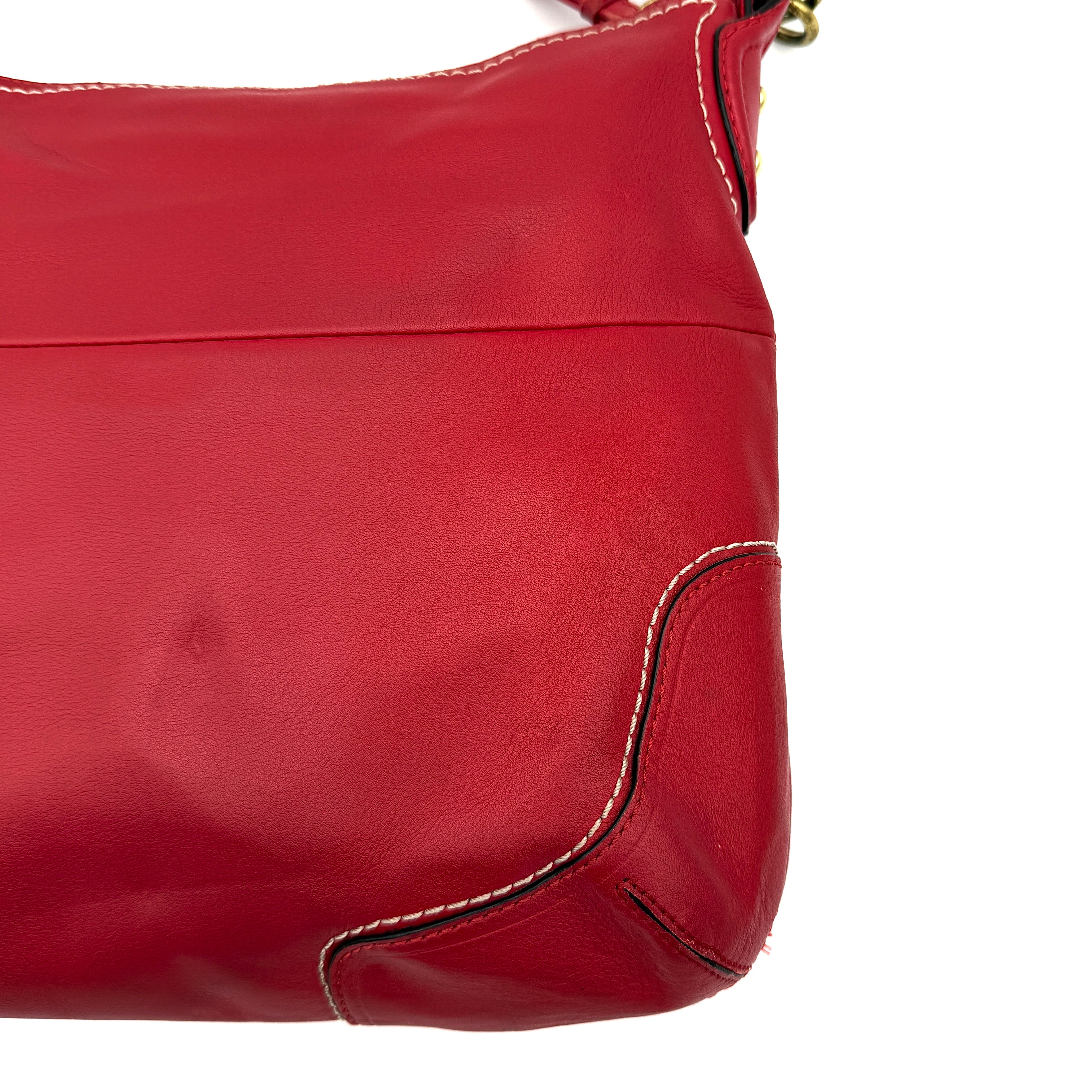 Coach Ashley Double Pocket Hobo in vibrant red leather, featuring distinctive front pockets, gold-tone hardware, and signature Coach hangtags.