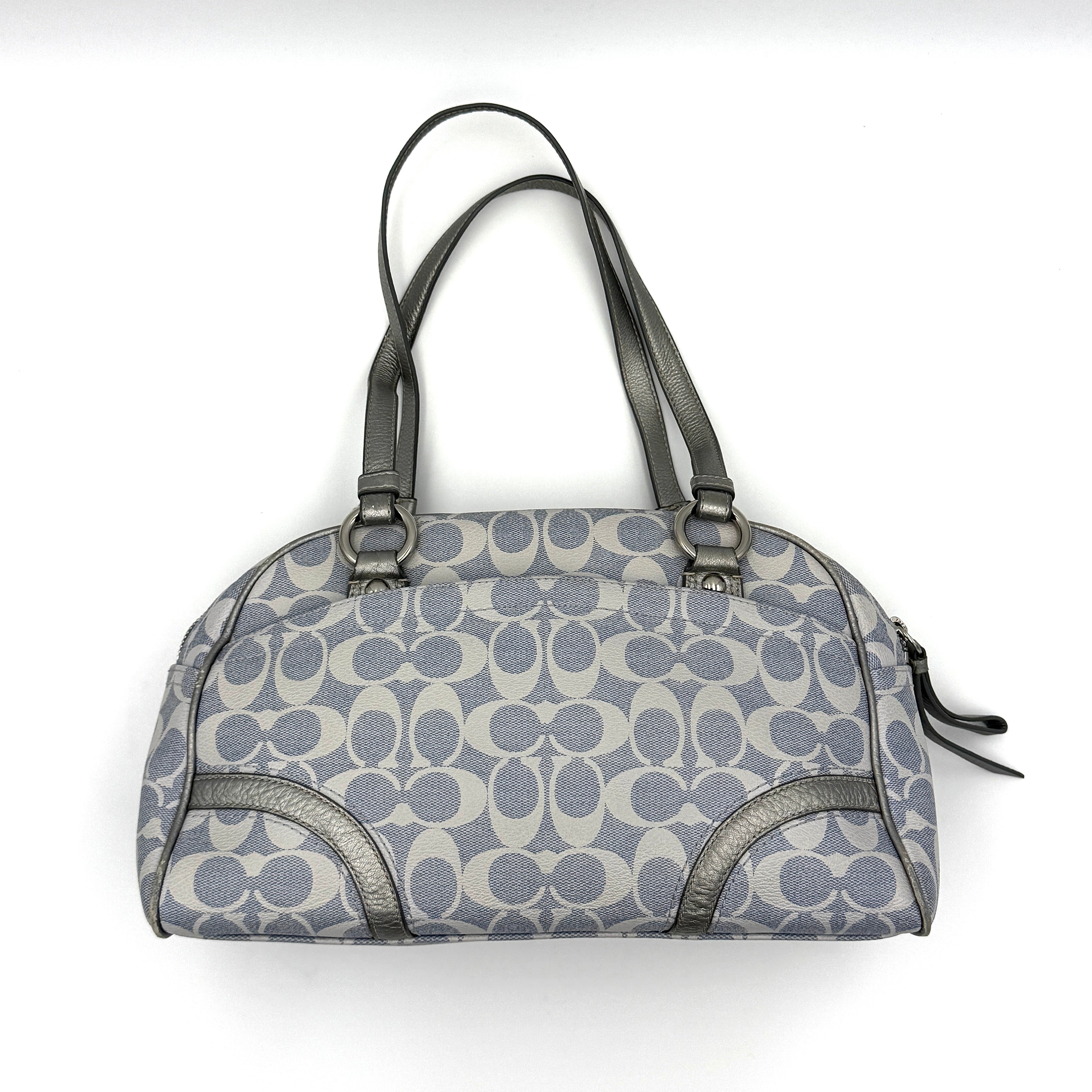 Coach Signature Peyton Satchel in light blue and grey canvas with metallic leather trim and double handles, shown against a white background.