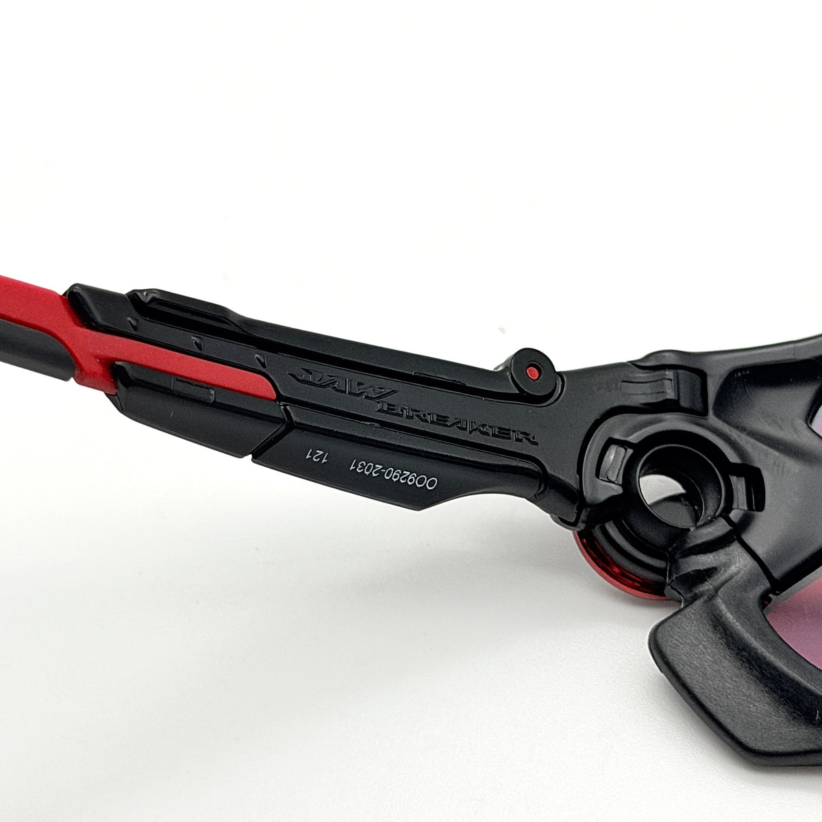 Oakley Jawbreaker Prizm sunglasses in matte black and red with pink-red Prizm lenses, shown with a black Oakley hard case and extra nose pad.