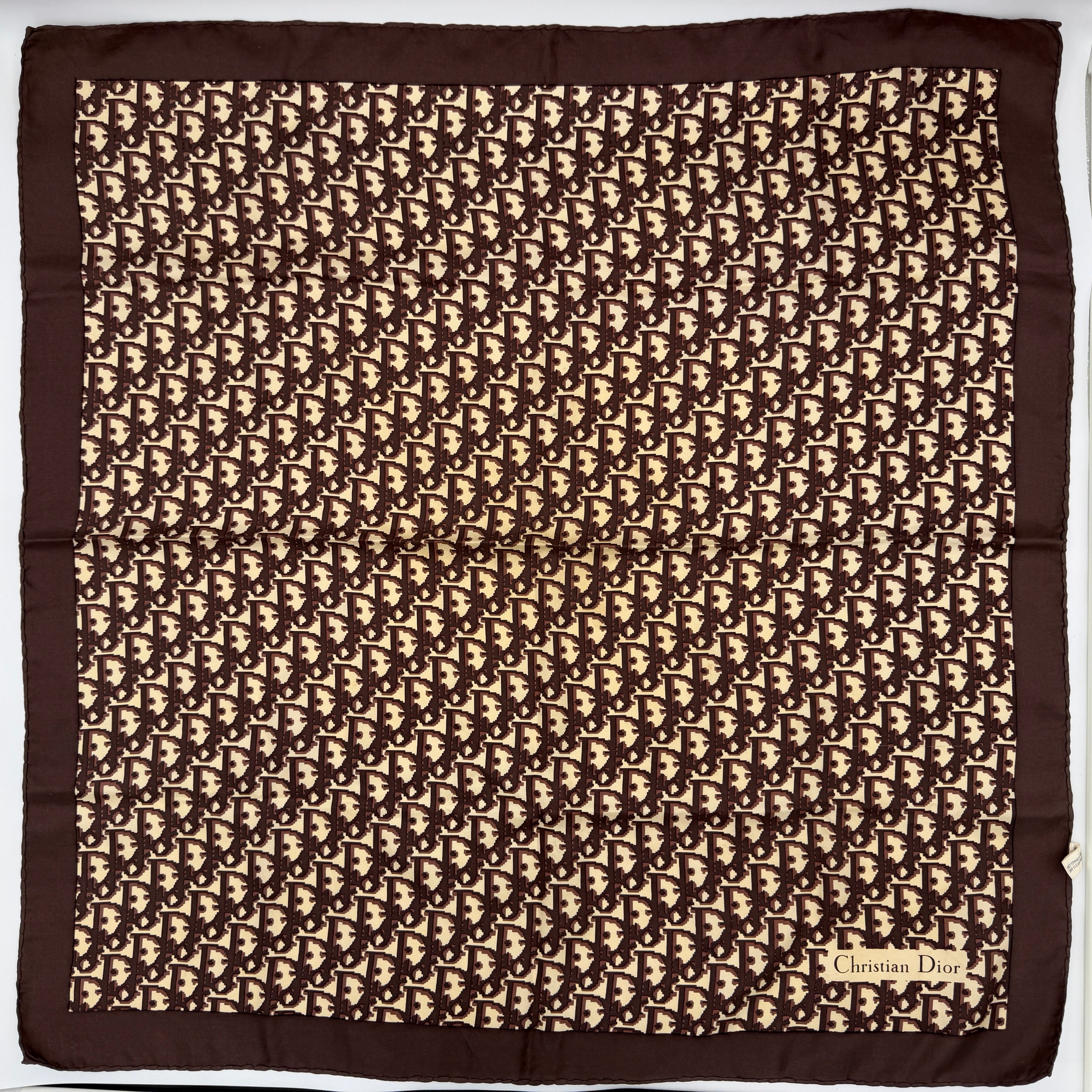 Dior Monogram Silk Scarf in brown and cream with allover Oblique pattern and Christian Dior signature in the corner.