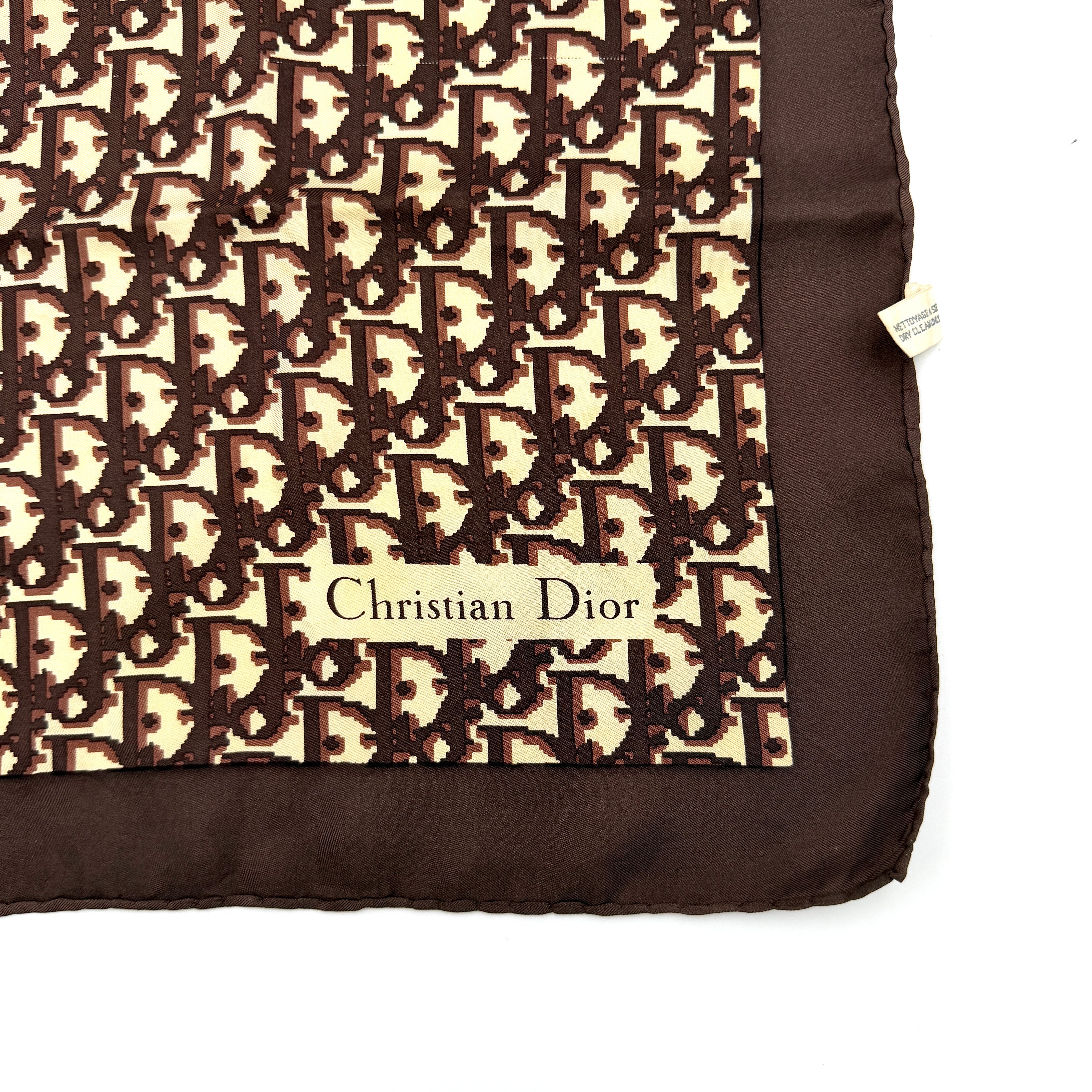 Dior Monogram Silk Scarf in brown and cream with allover Oblique pattern and Christian Dior signature in the corner.