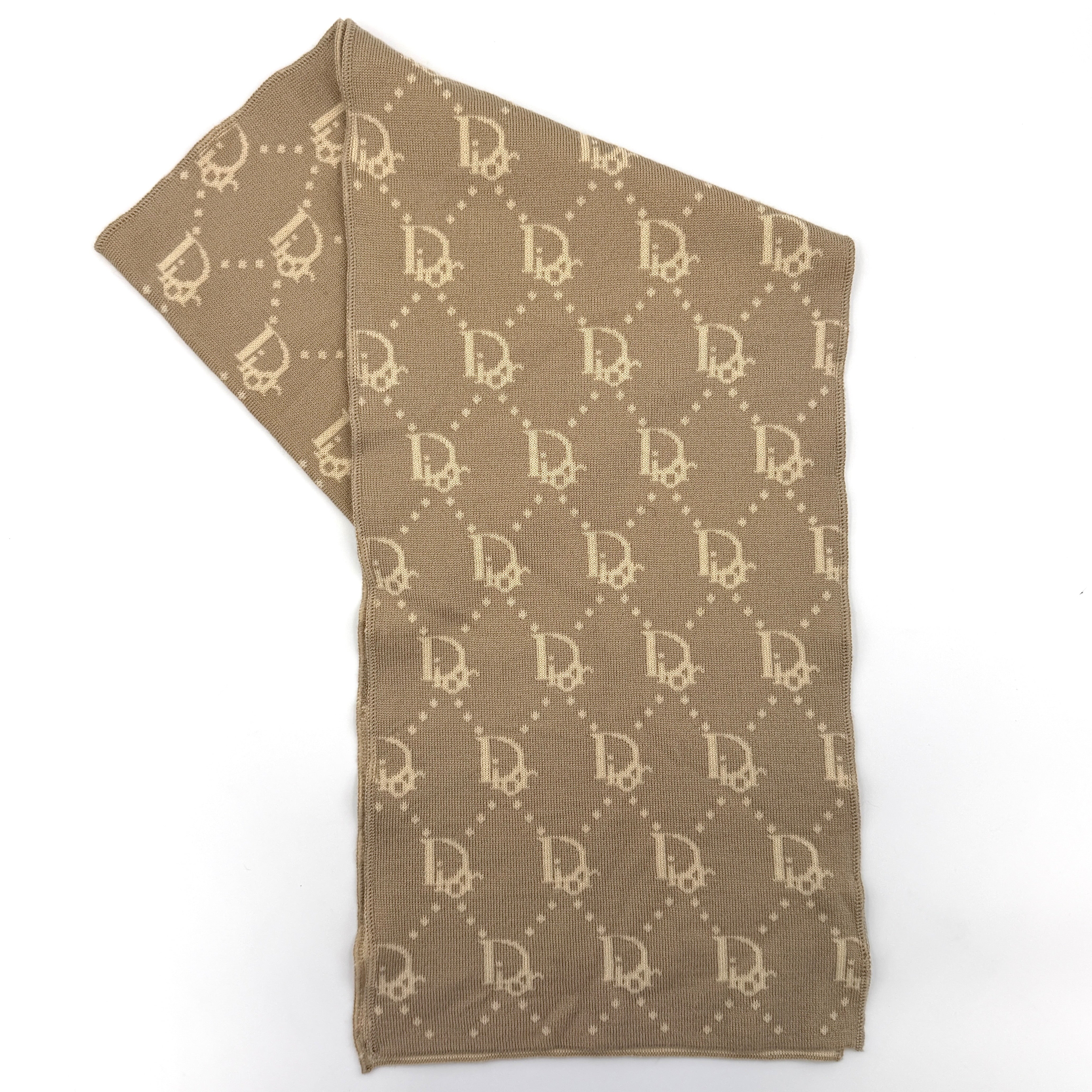 Beige Dior wool scarf featuring an all-over monogram jacquard pattern, elegantly displayed to reveal both sides' colour contrast.