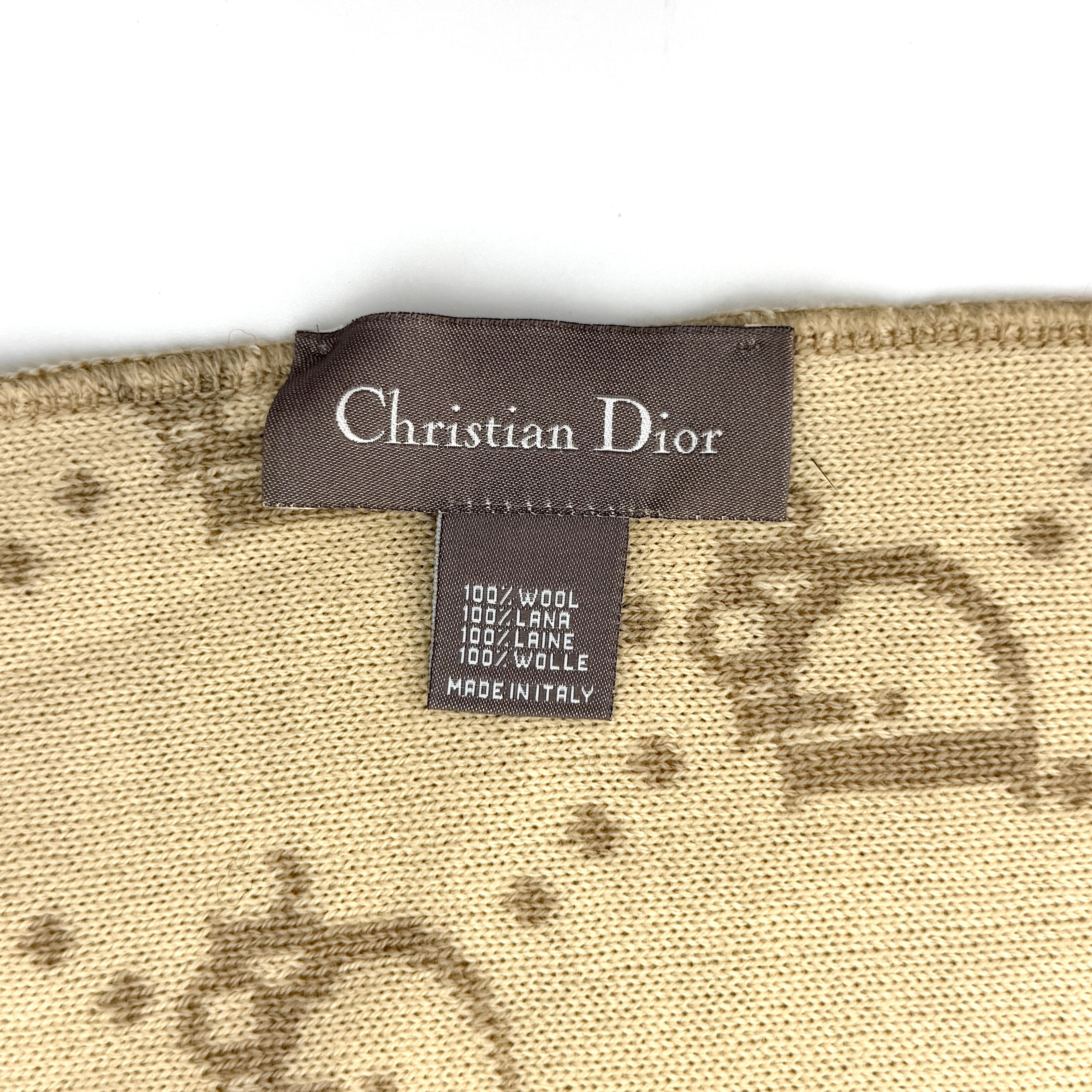 Beige Dior wool scarf featuring an all-over monogram jacquard pattern, elegantly displayed to reveal both sides' colour contrast.
