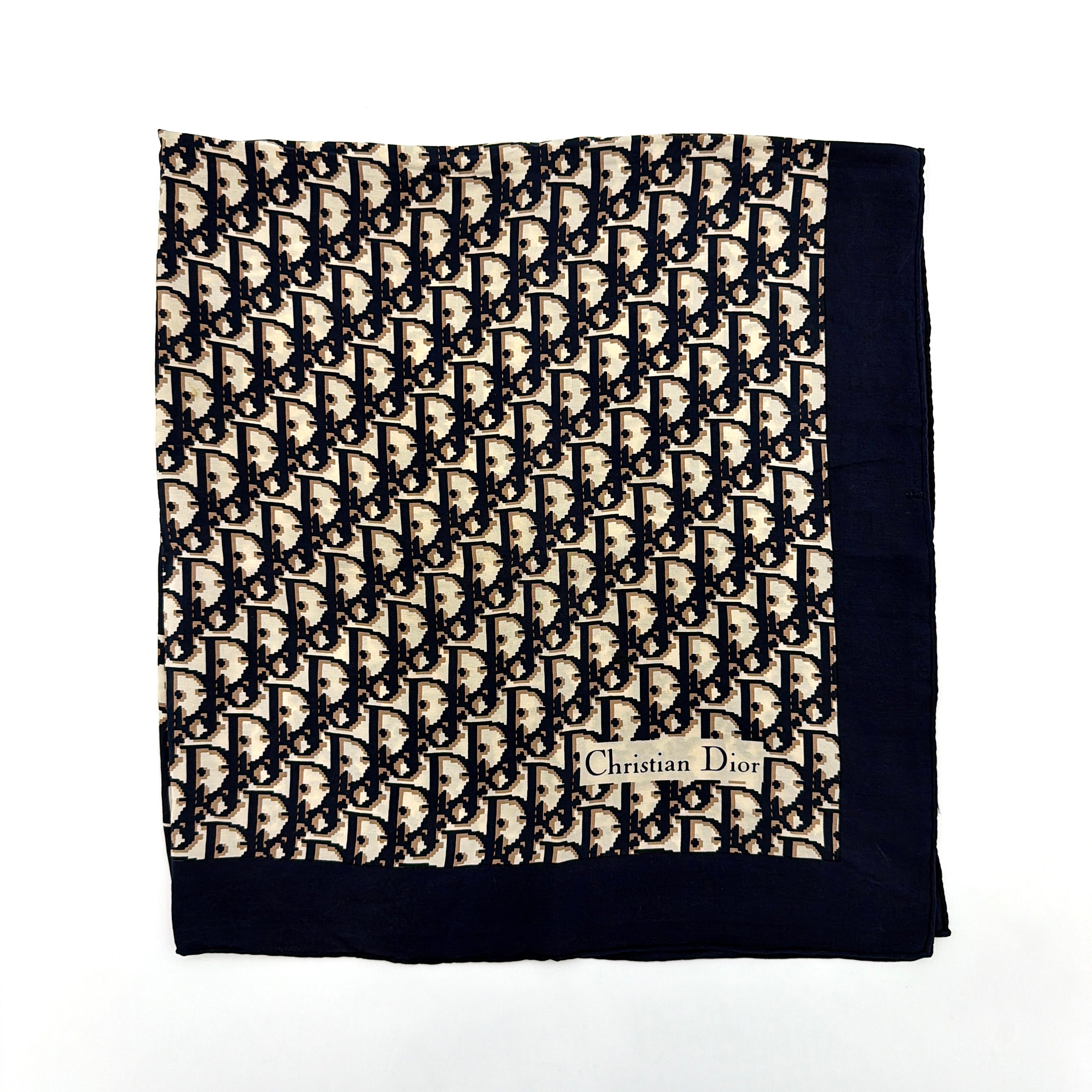 Dior Monogram Silk Scarf in navy blue and cream, featuring the classic oblique CD pattern and a navy border with a Christian Dior signature.