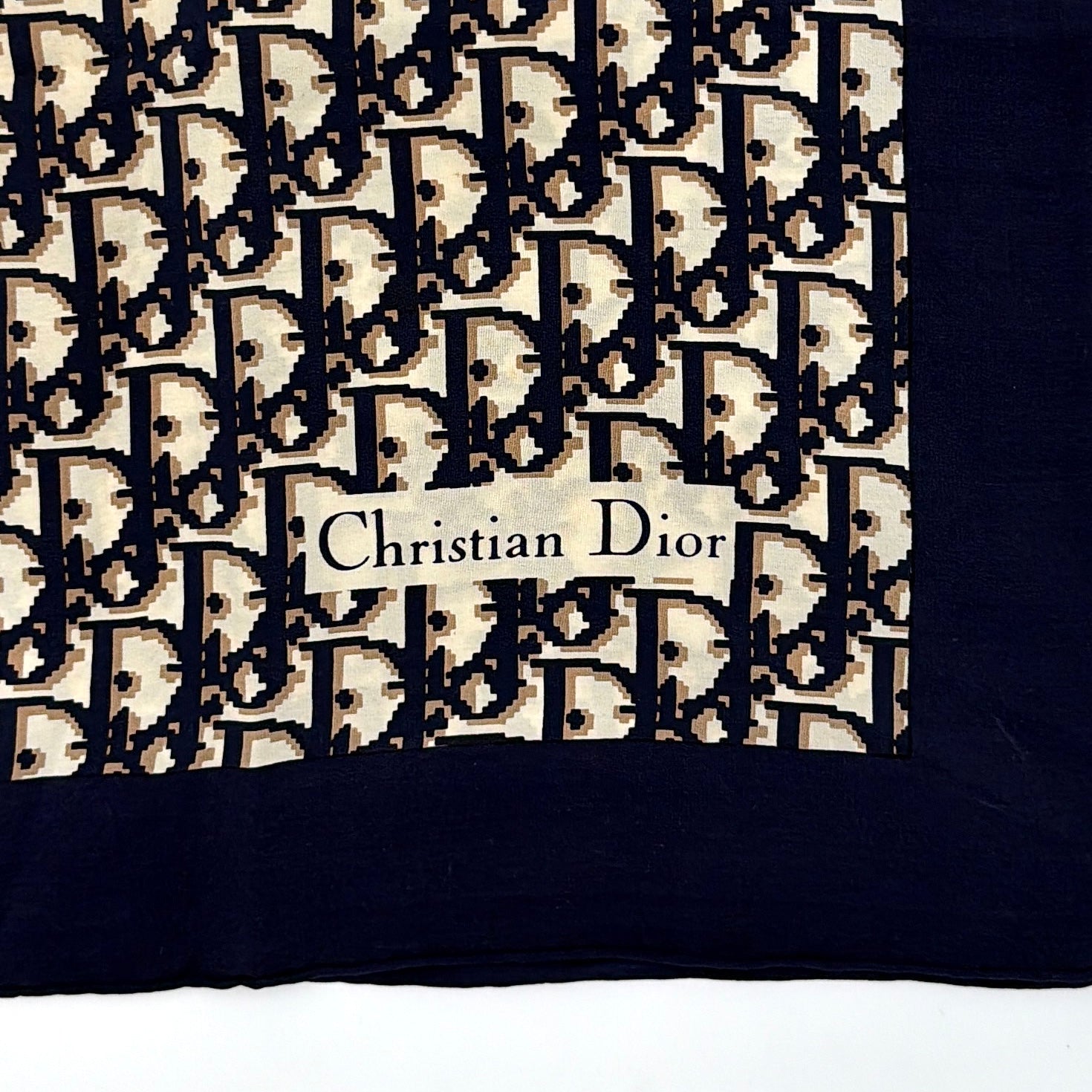 Dior Monogram Silk Scarf in navy blue and cream, featuring the classic oblique CD pattern and a navy border with a Christian Dior signature.