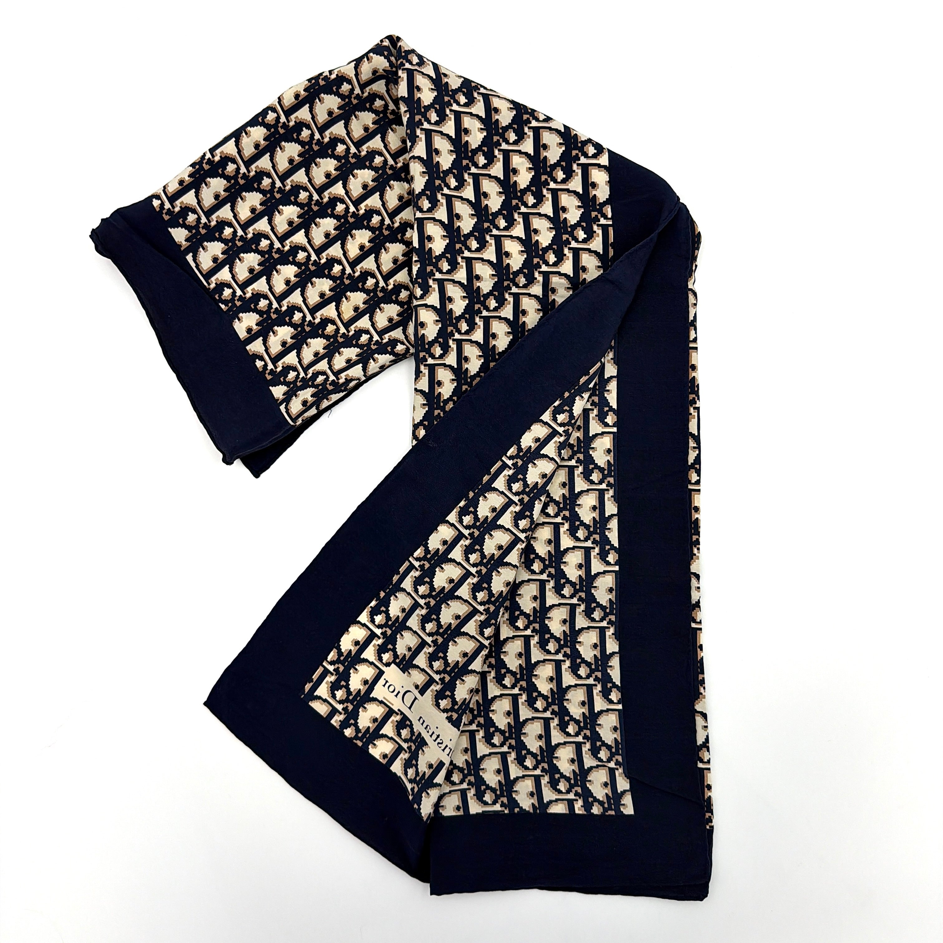 Dior Monogram Silk Scarf in navy blue and cream, featuring the classic oblique CD pattern and a navy border with a Christian Dior signature.