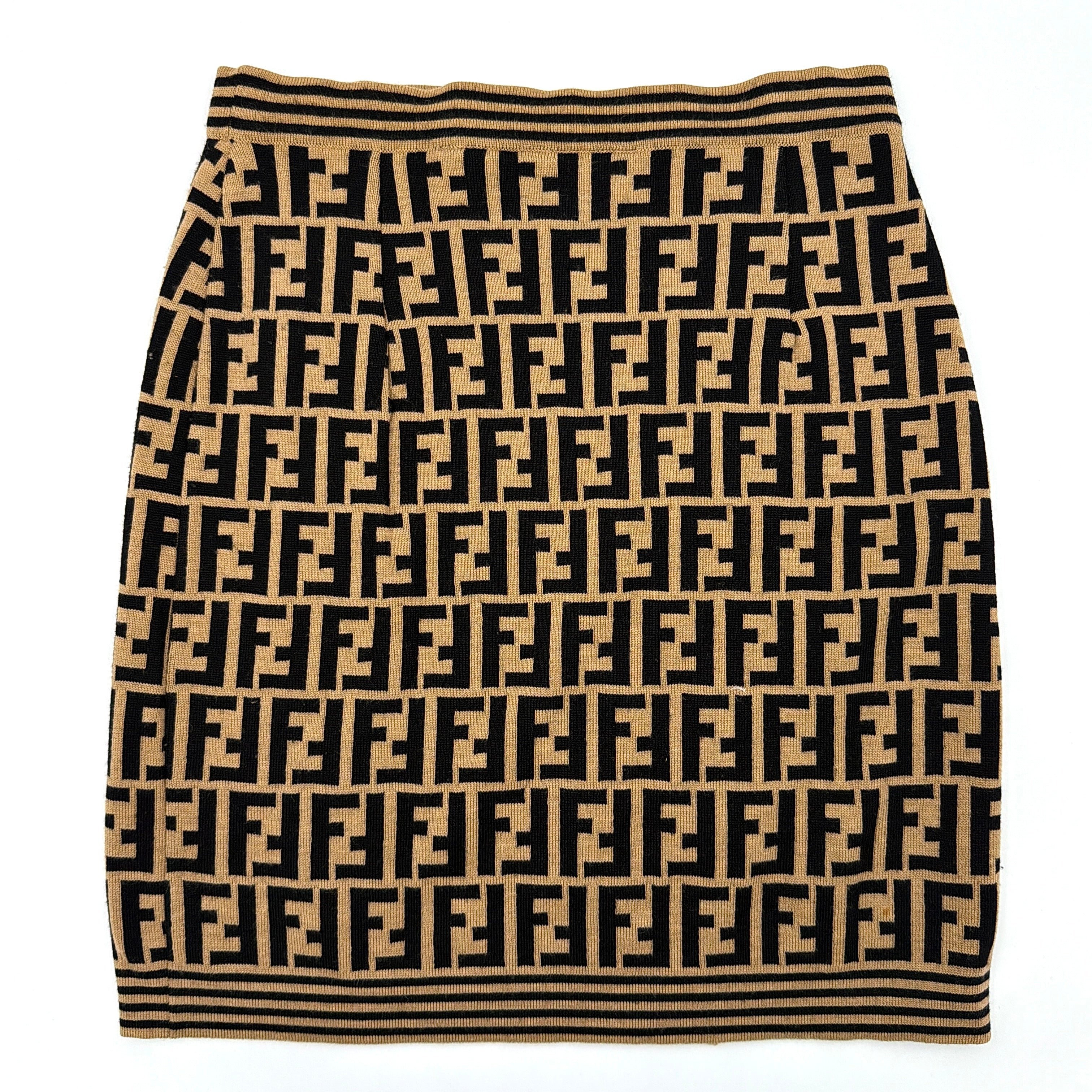 Fendi brown knit skirt with bold black FF Zucca monogram and side stripe detail, displayed flat to showcase its sculpted silhouette.