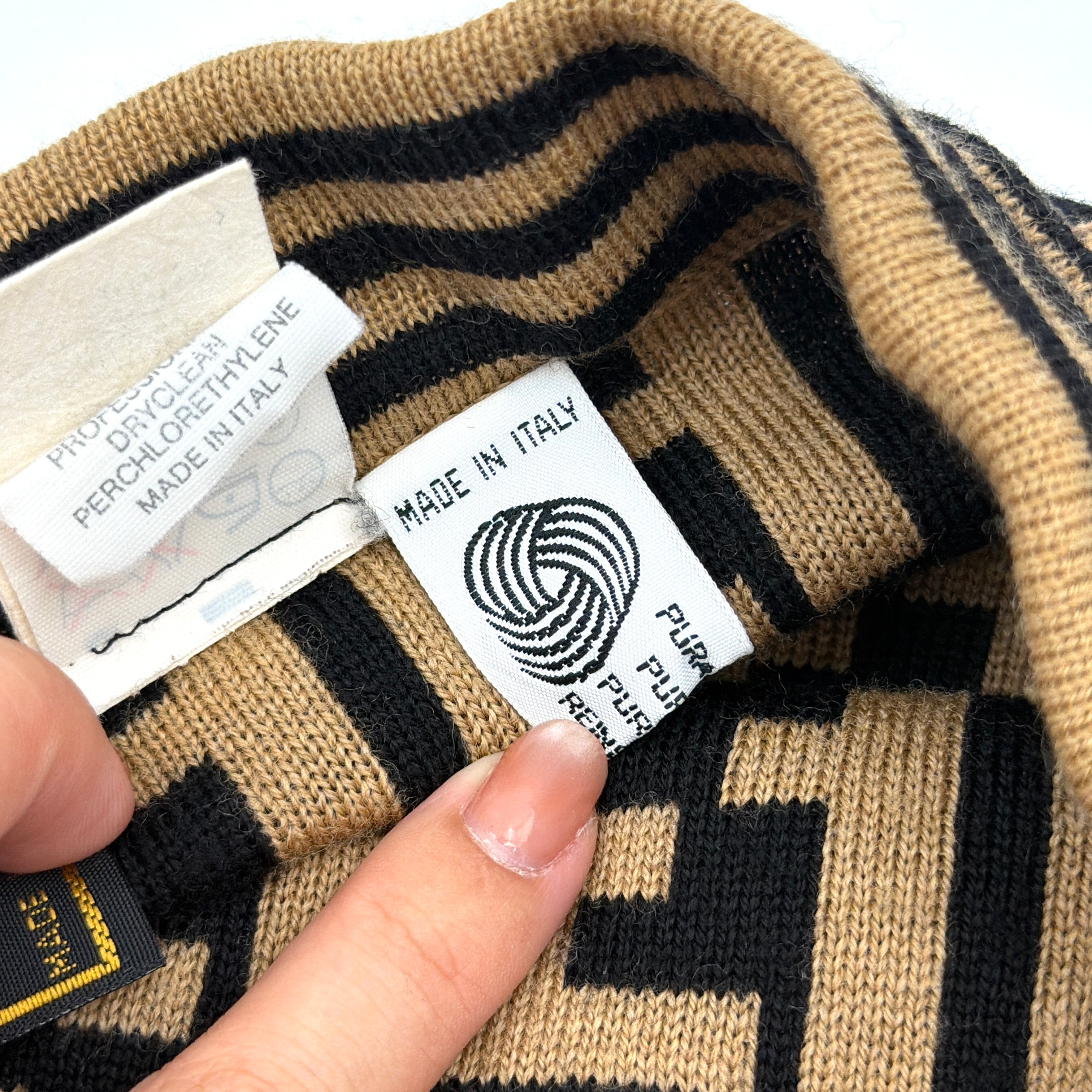 Fendi brown knit skirt with bold black FF Zucca monogram and side stripe detail, displayed flat to showcase its sculpted silhouette.