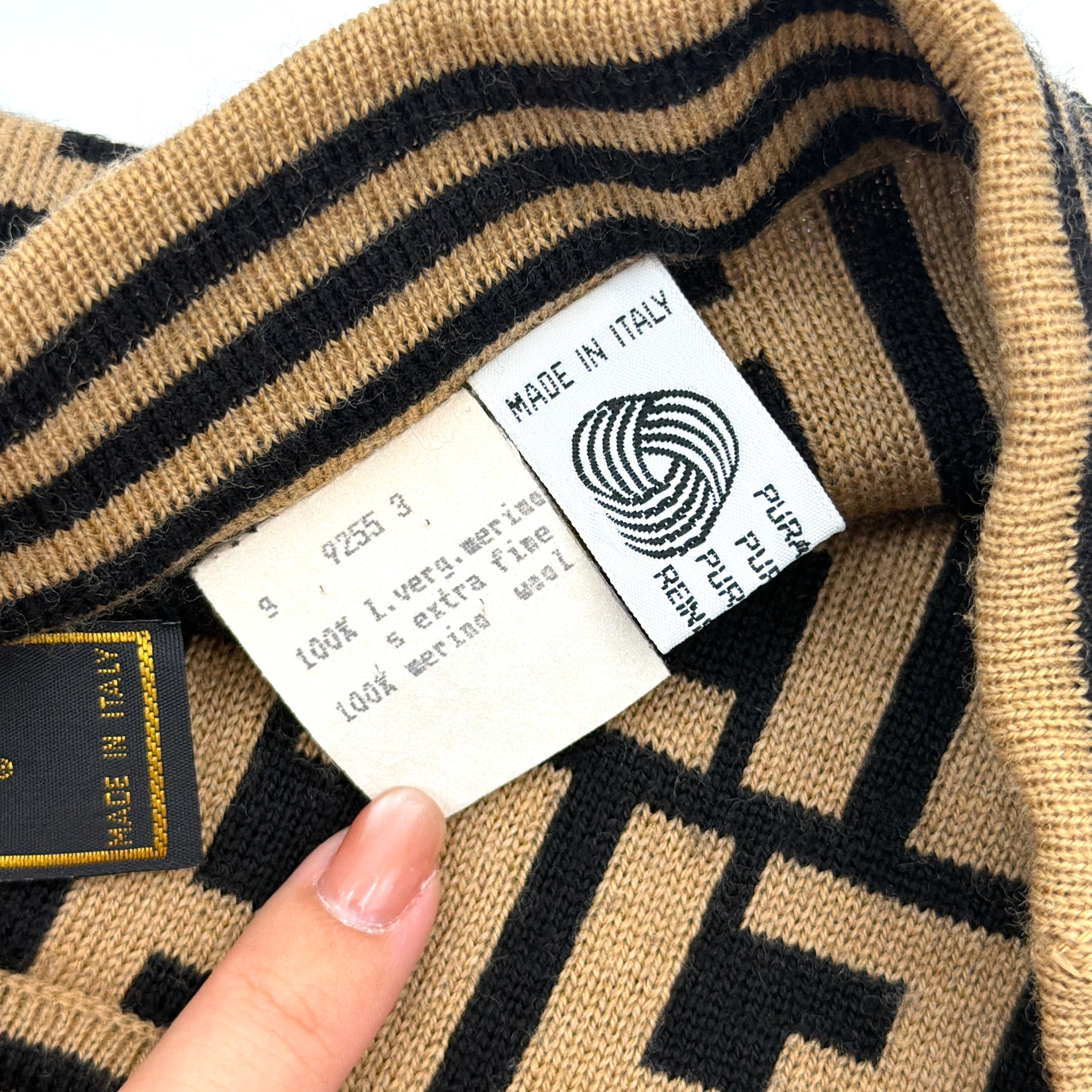 Fendi brown knit skirt with bold black FF Zucca monogram and side stripe detail, displayed flat to showcase its sculpted silhouette.