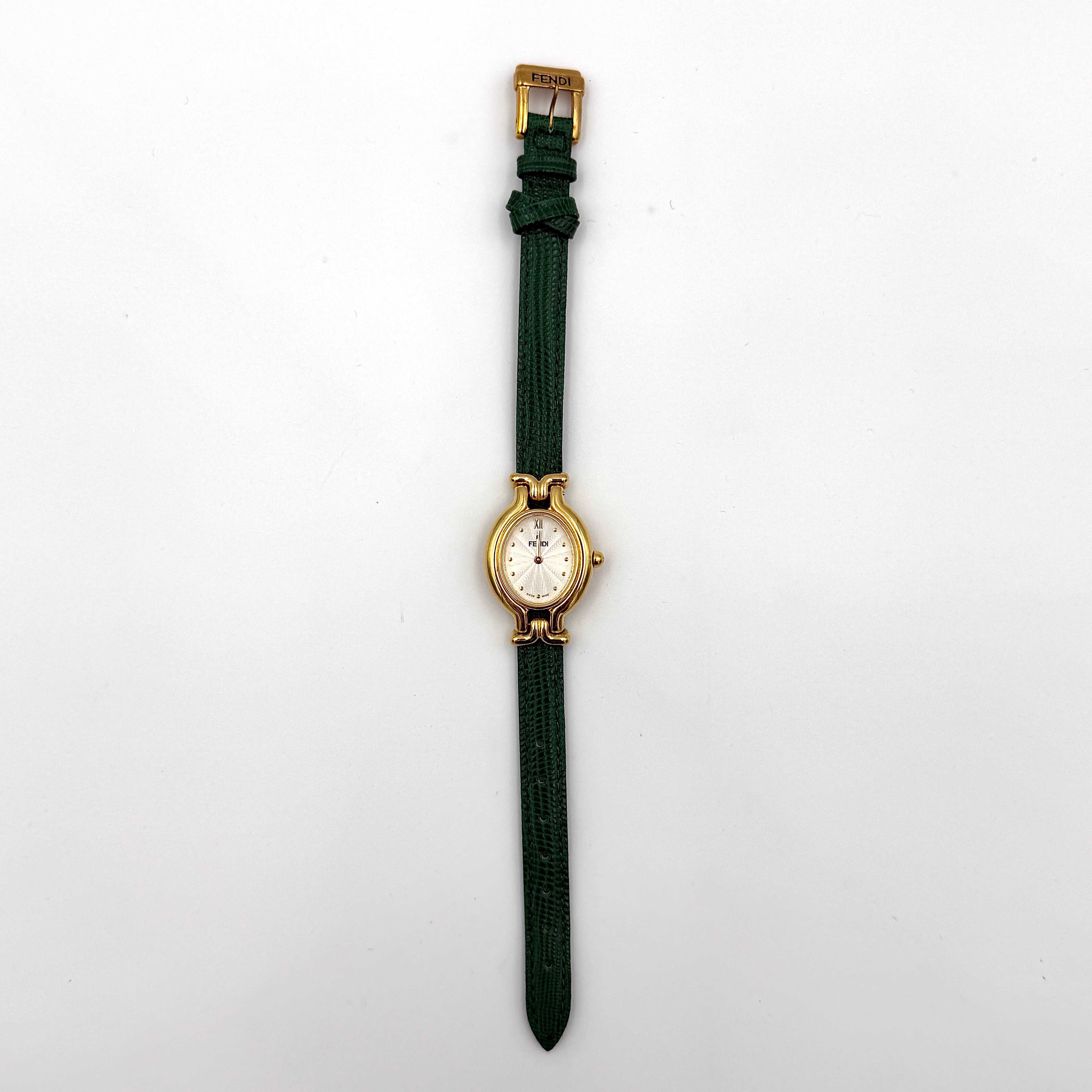 Fendi 640L Chameleon watch with five colored leather straps and gold-tone case displayed in a row.