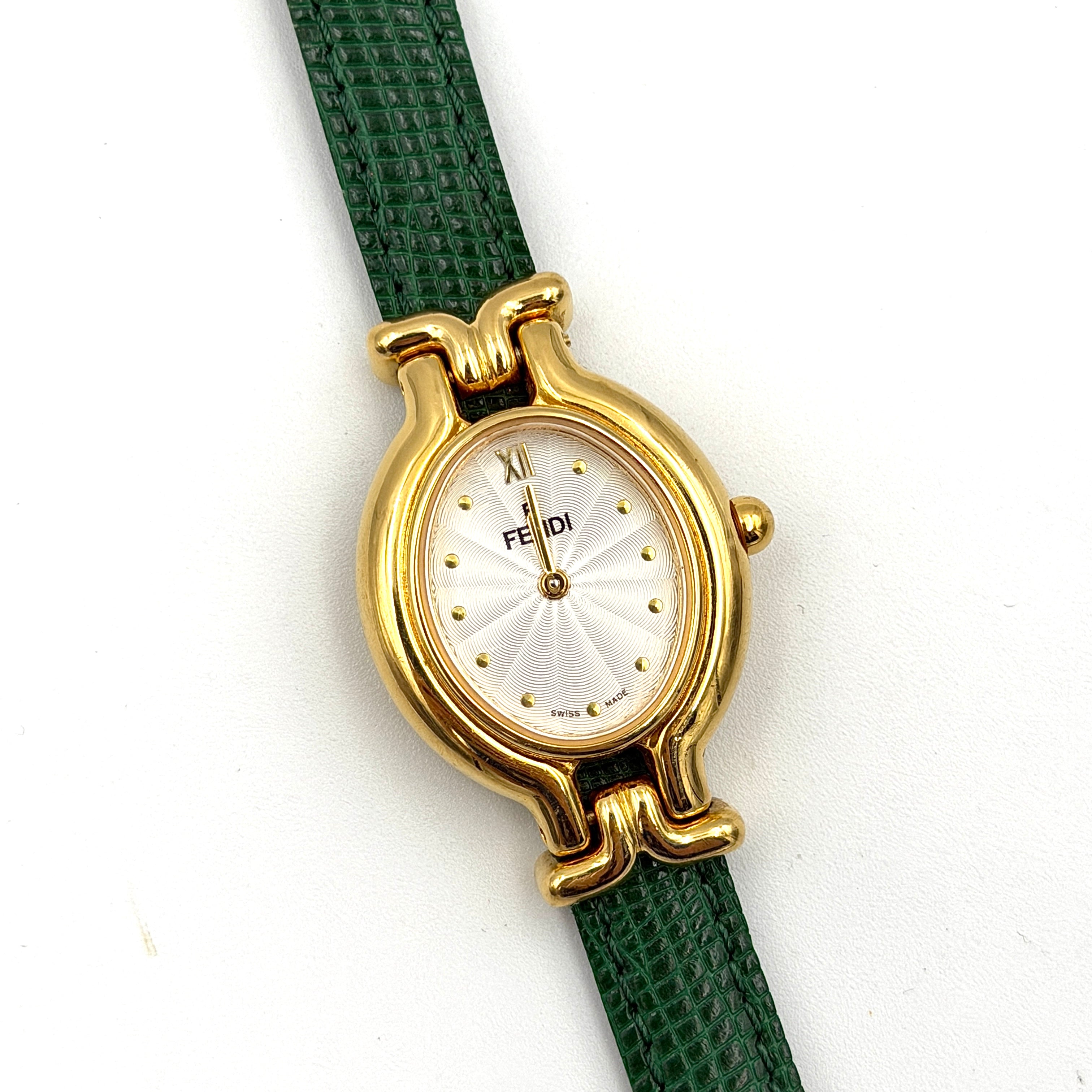 Fendi 640L Chameleon watch with five colored leather straps and gold-tone case displayed in a row.