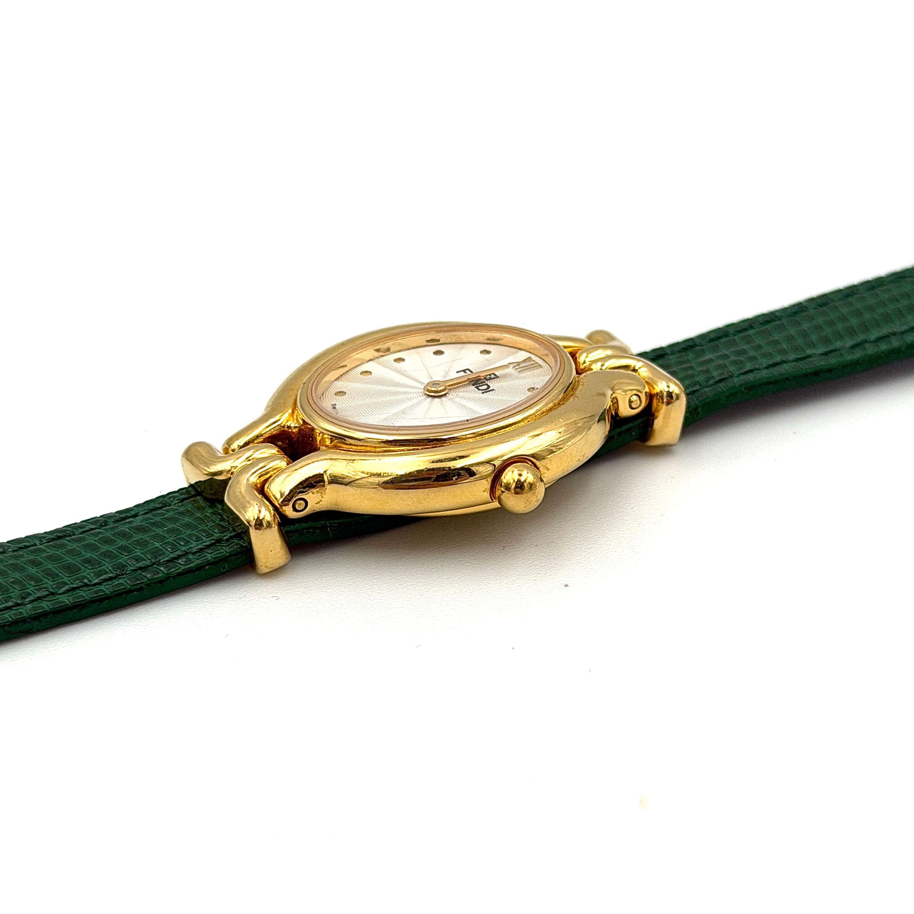 Fendi 640L Chameleon watch with five colored leather straps and gold-tone case displayed in a row.