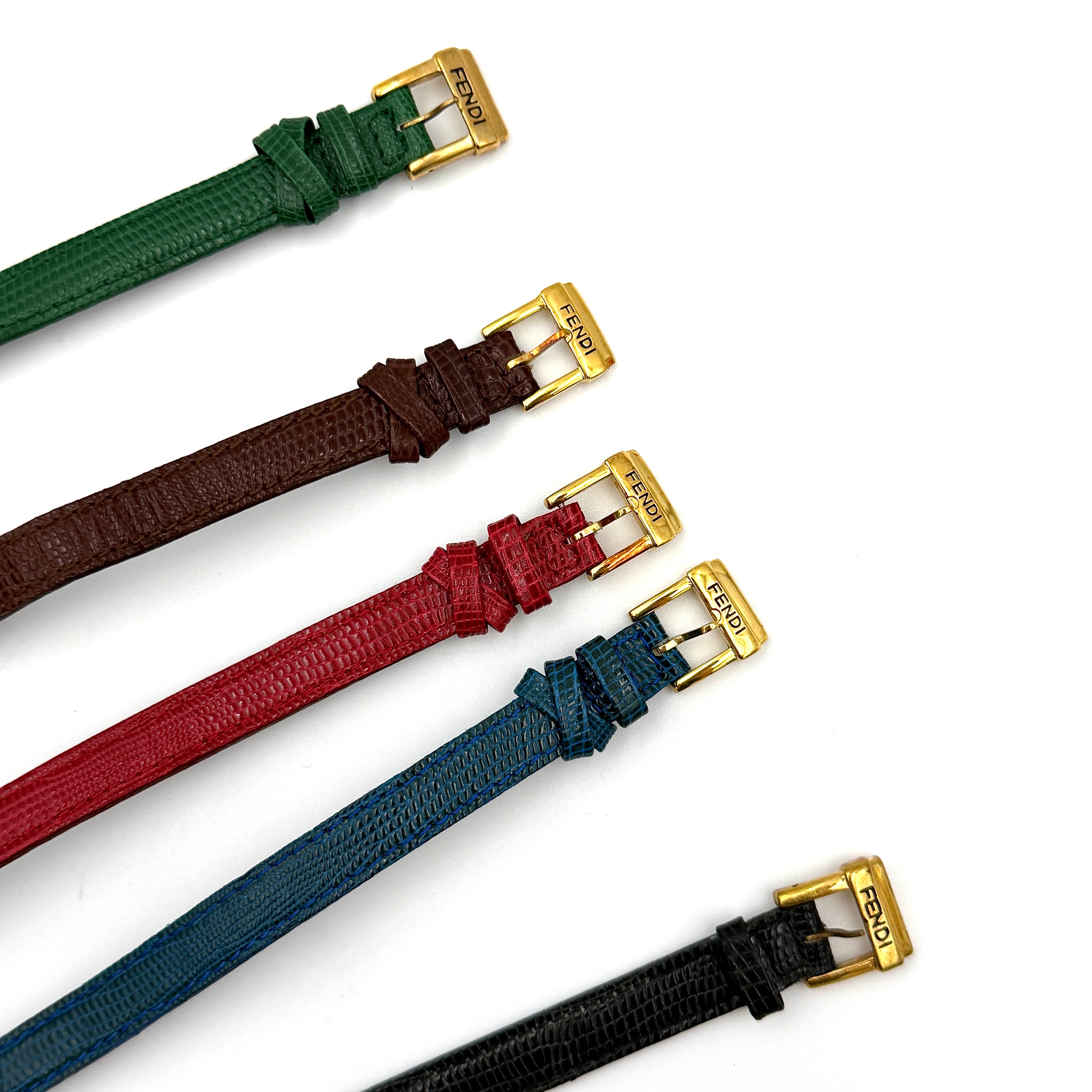 Fendi 640L Chameleon watch with five colored leather straps and gold-tone case displayed in a row.