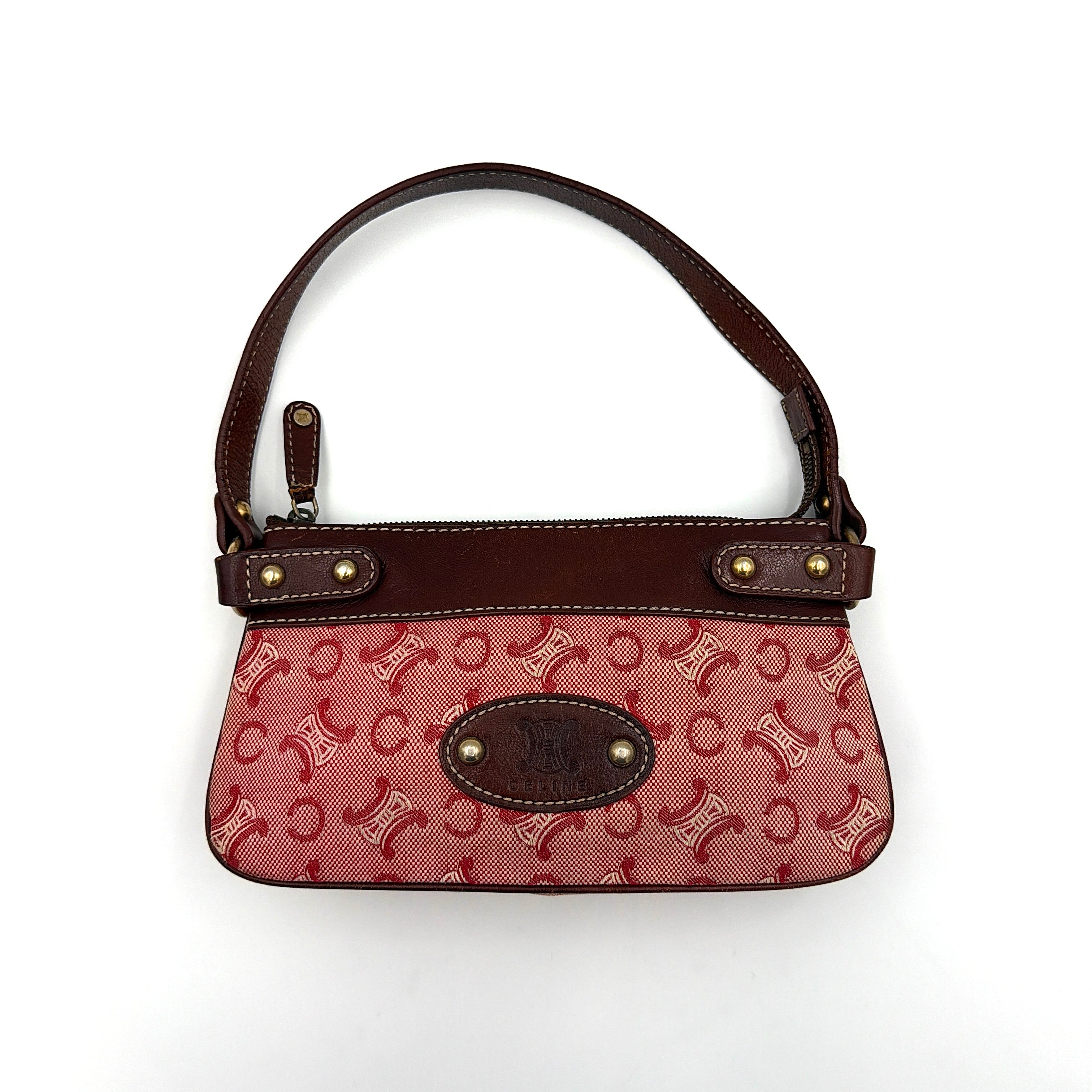 Celine Macadam shoulder bag in red coated canvas with brown leather trim and gold-tone hardware.
