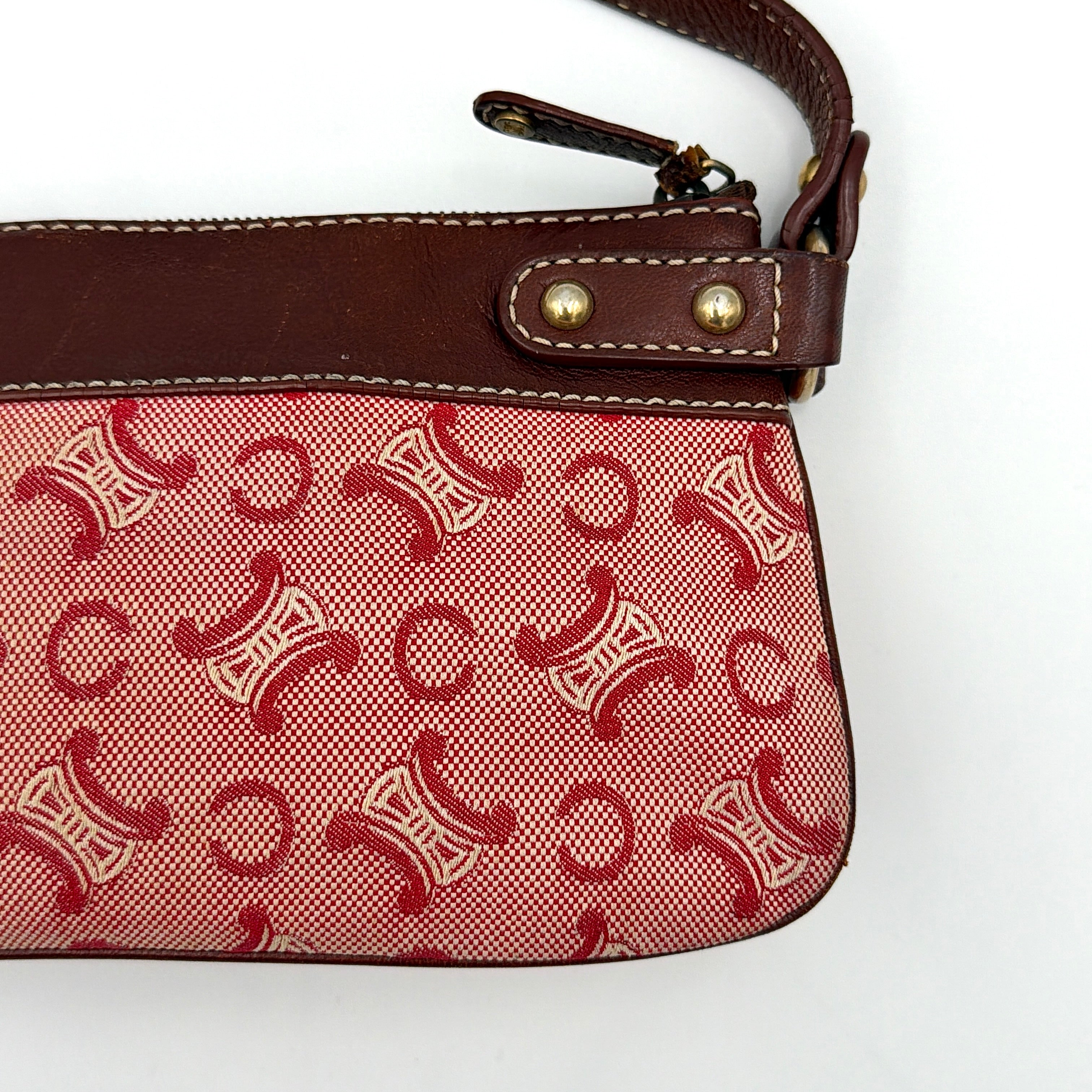 Celine Macadam shoulder bag in red coated canvas with brown leather trim and gold-tone hardware.