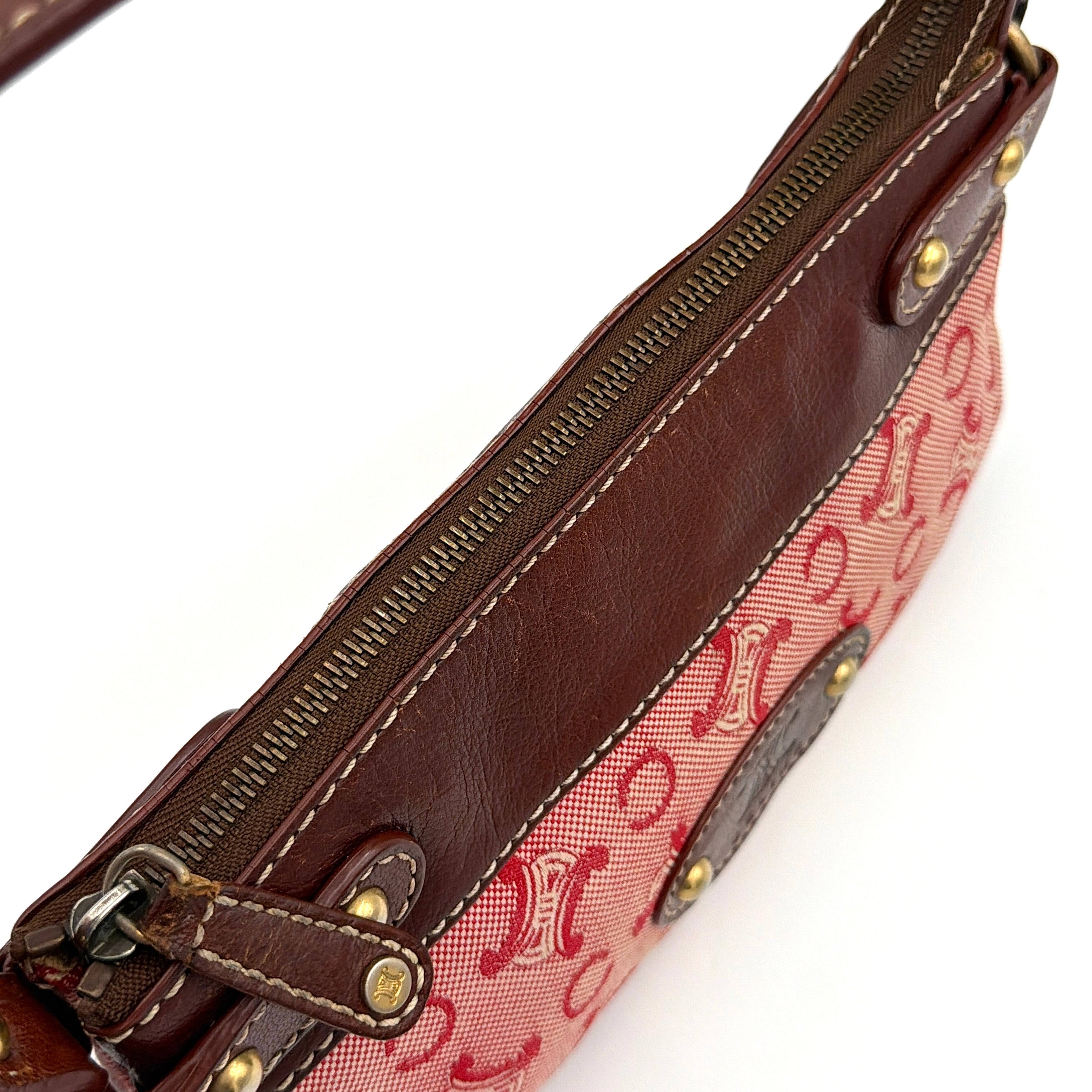 Celine Macadam shoulder bag in red coated canvas with brown leather trim and gold-tone hardware.