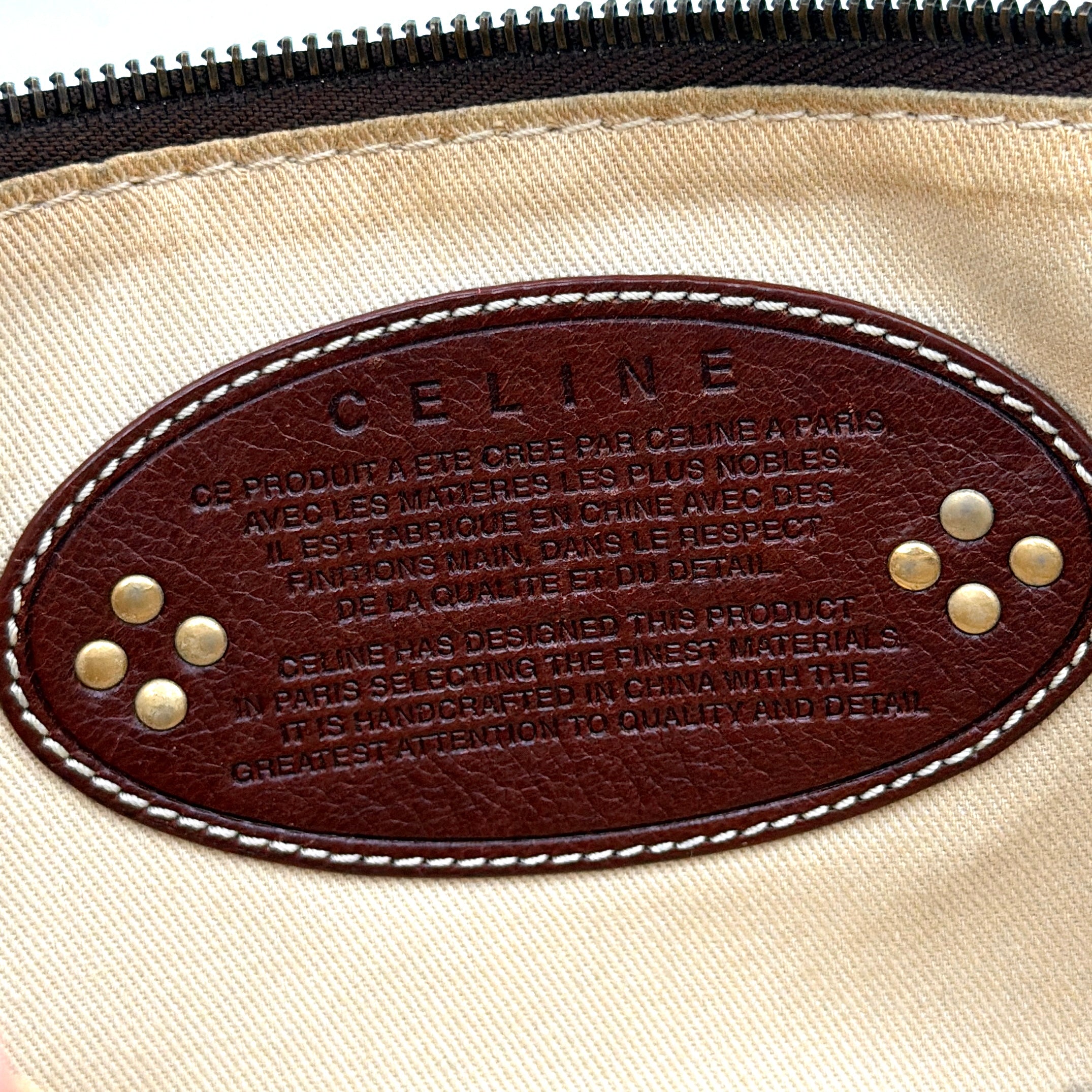 Celine Macadam shoulder bag in red coated canvas with brown leather trim and gold-tone hardware.