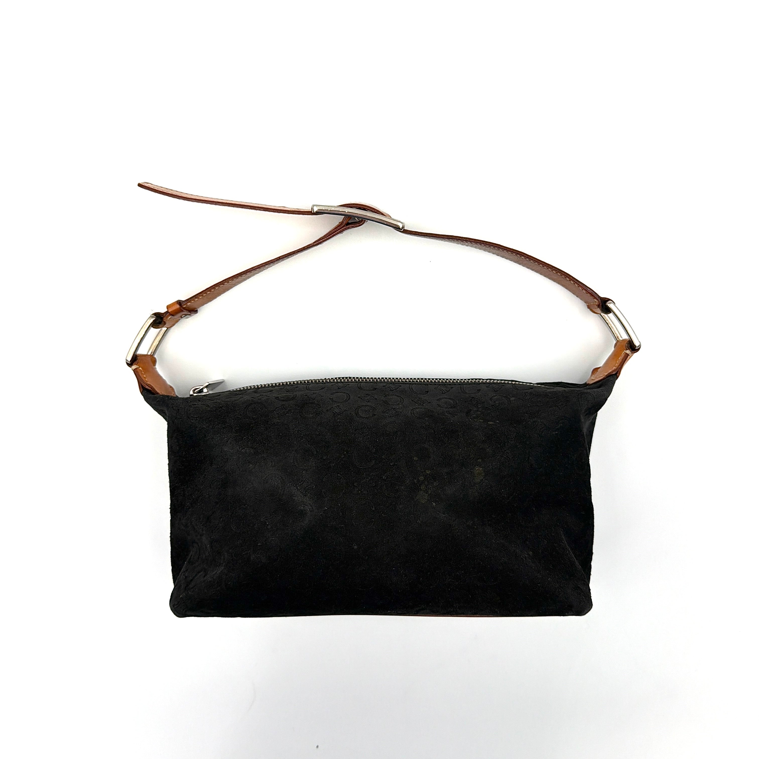 Celine black suede shoulder bag with embossed Triomphe motif, tan leather strap and silver-tone hardware, displayed from the front.