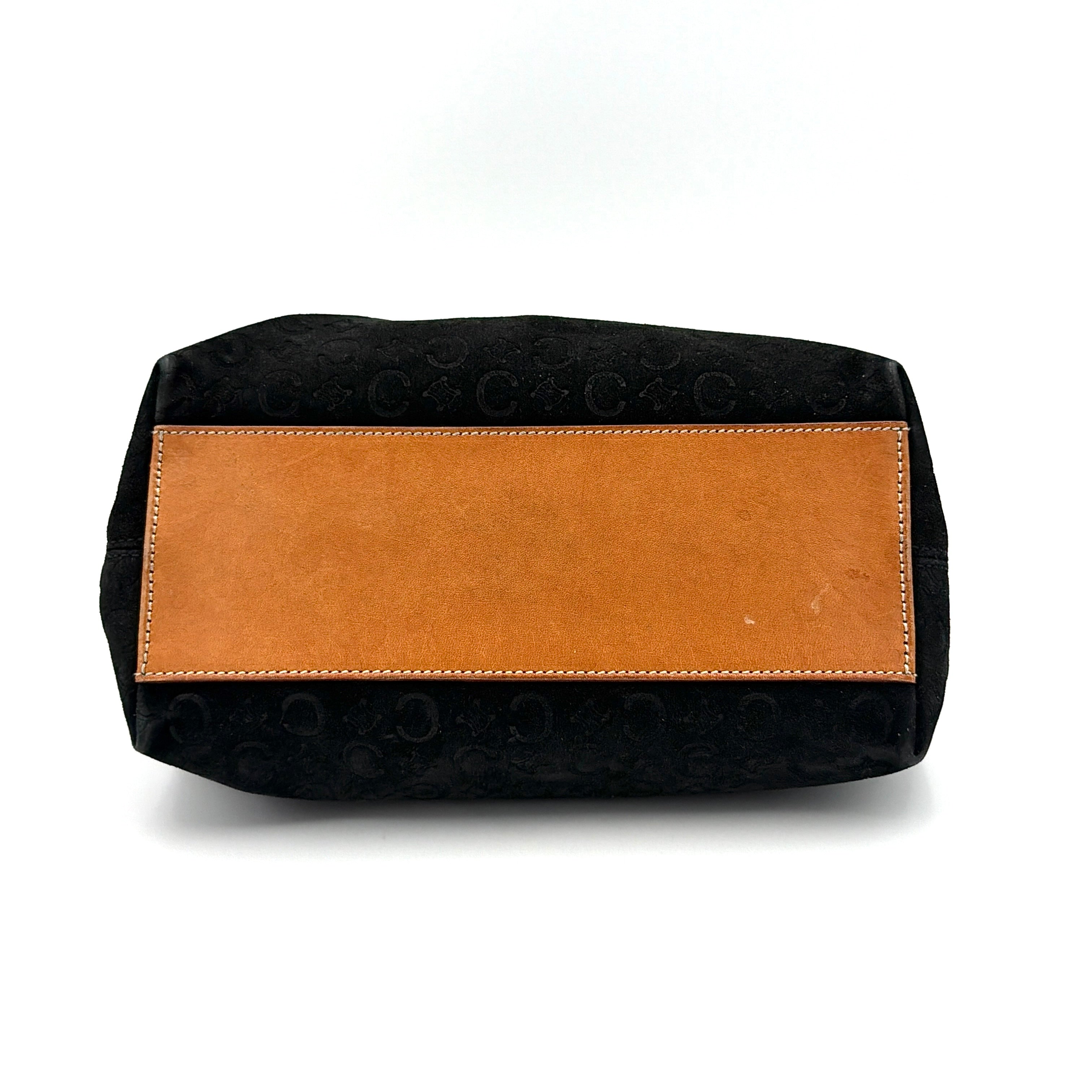 Celine black suede shoulder bag with embossed Triomphe motif, tan leather strap and silver-tone hardware, displayed from the front.