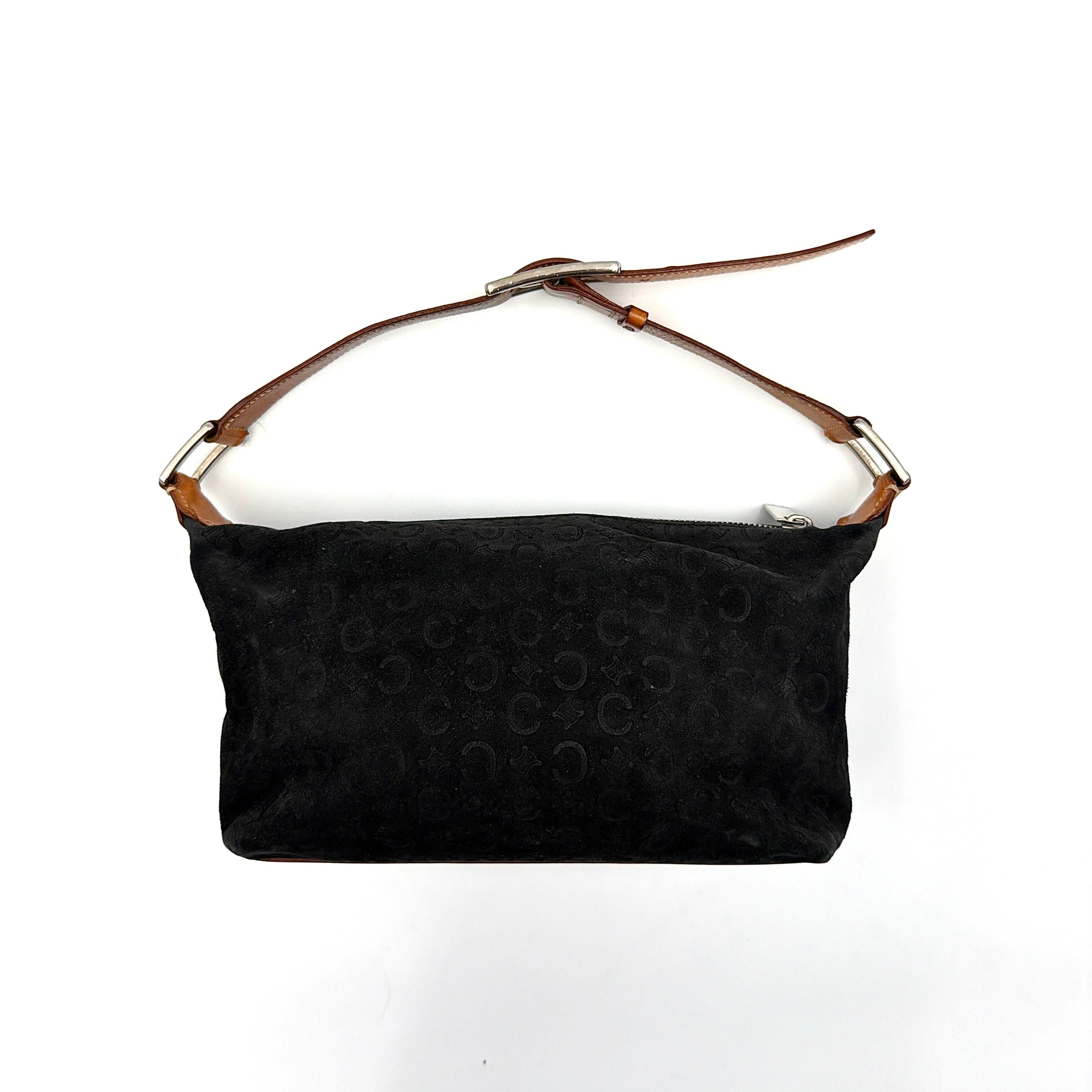 Celine black suede shoulder bag with embossed Triomphe motif, tan leather strap and silver-tone hardware, displayed from the front.