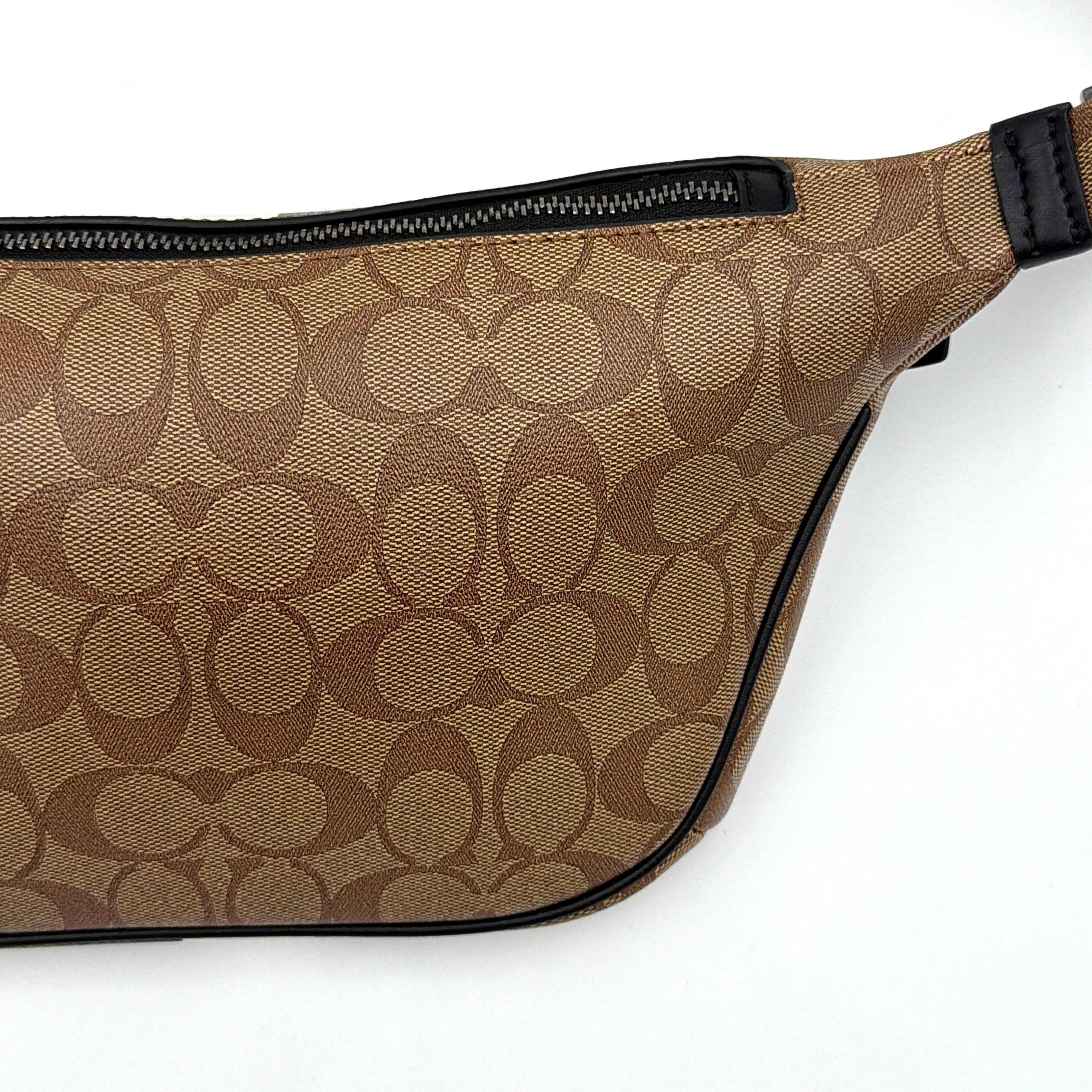 Coach Signature Warren Stripe Belt Bag in beige canvas with black and ivory vertical stripes and adjustable black strap.