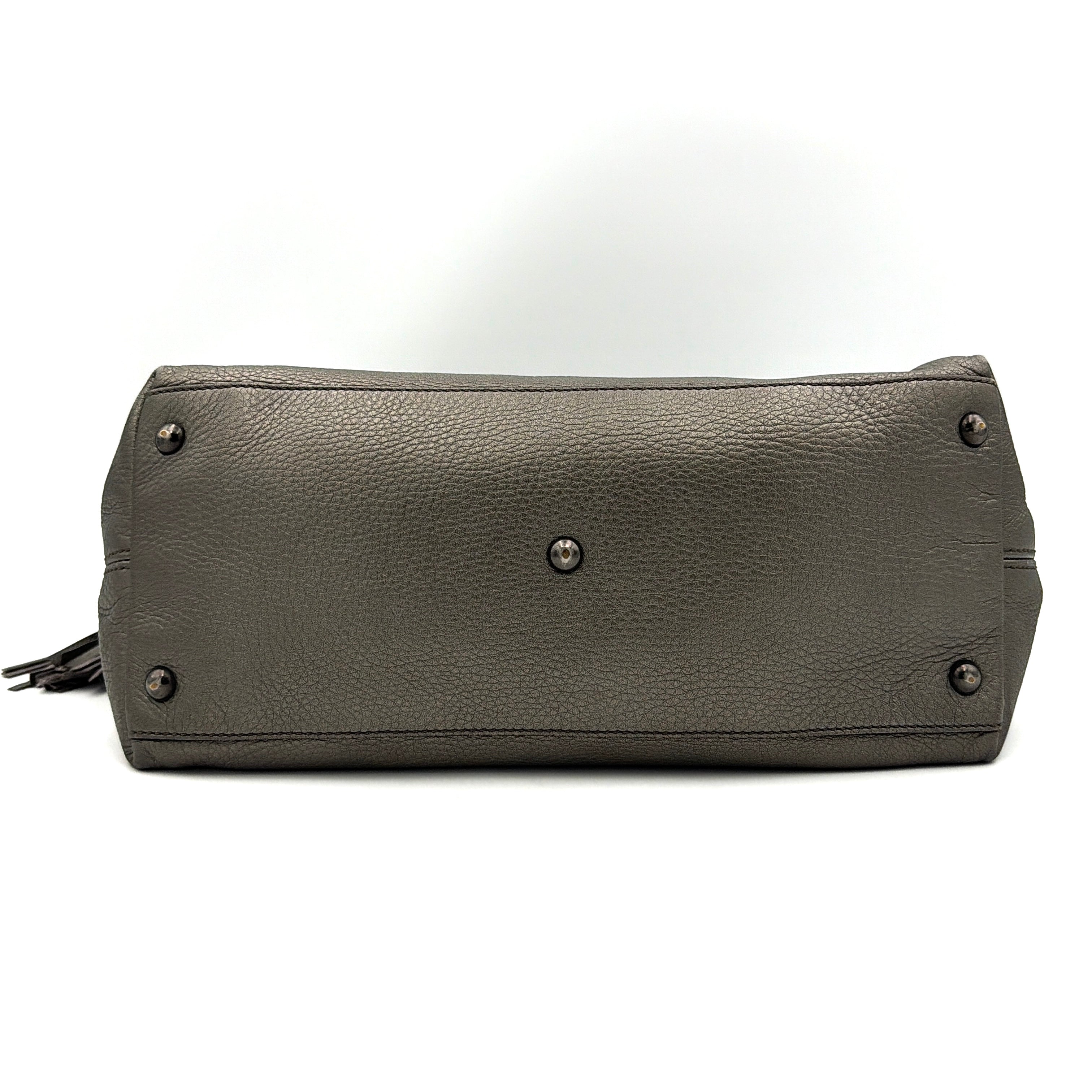 Gucci GG Soho Shoulder Bag in grey pebbled leather, featuring dual top handles, oversized stitched GG logo, and a leather tassel zip pull.