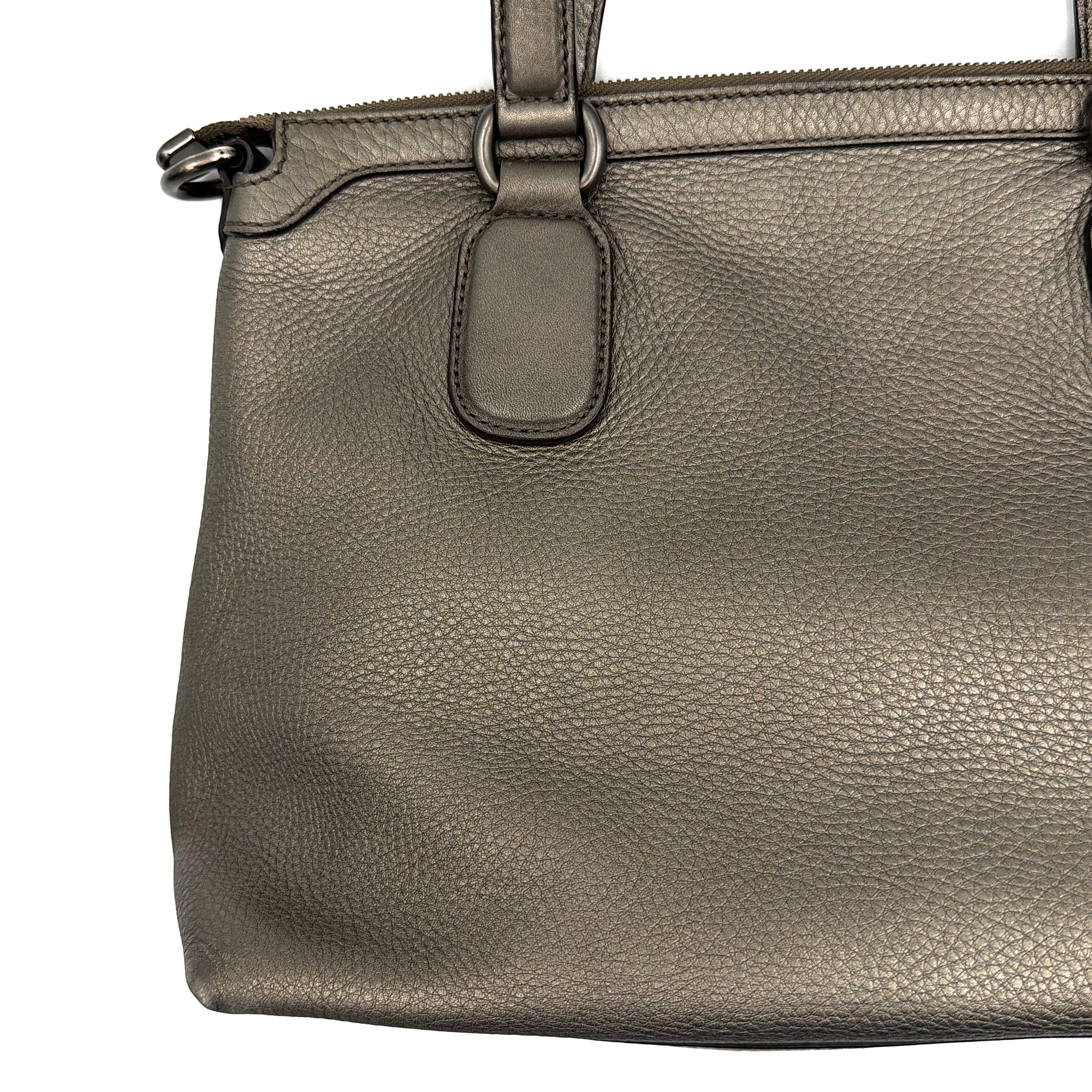 Gucci GG Soho Shoulder Bag in grey pebbled leather, featuring dual top handles, oversized stitched GG logo, and a leather tassel zip pull.