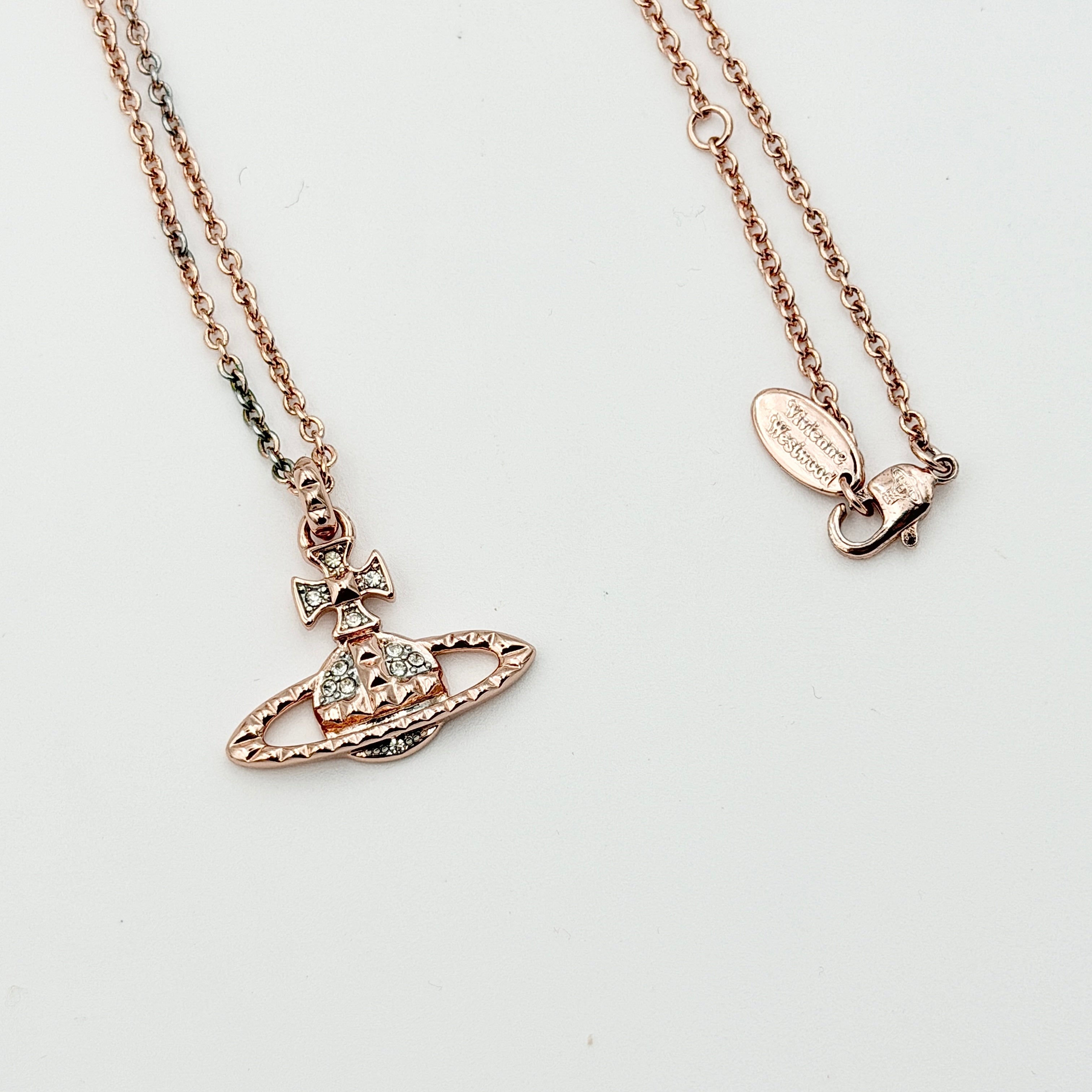 Vivienne Westwood Orb Necklace in rose gold and silver, presented on a fine chain with the signature crystal-embellished pendant.