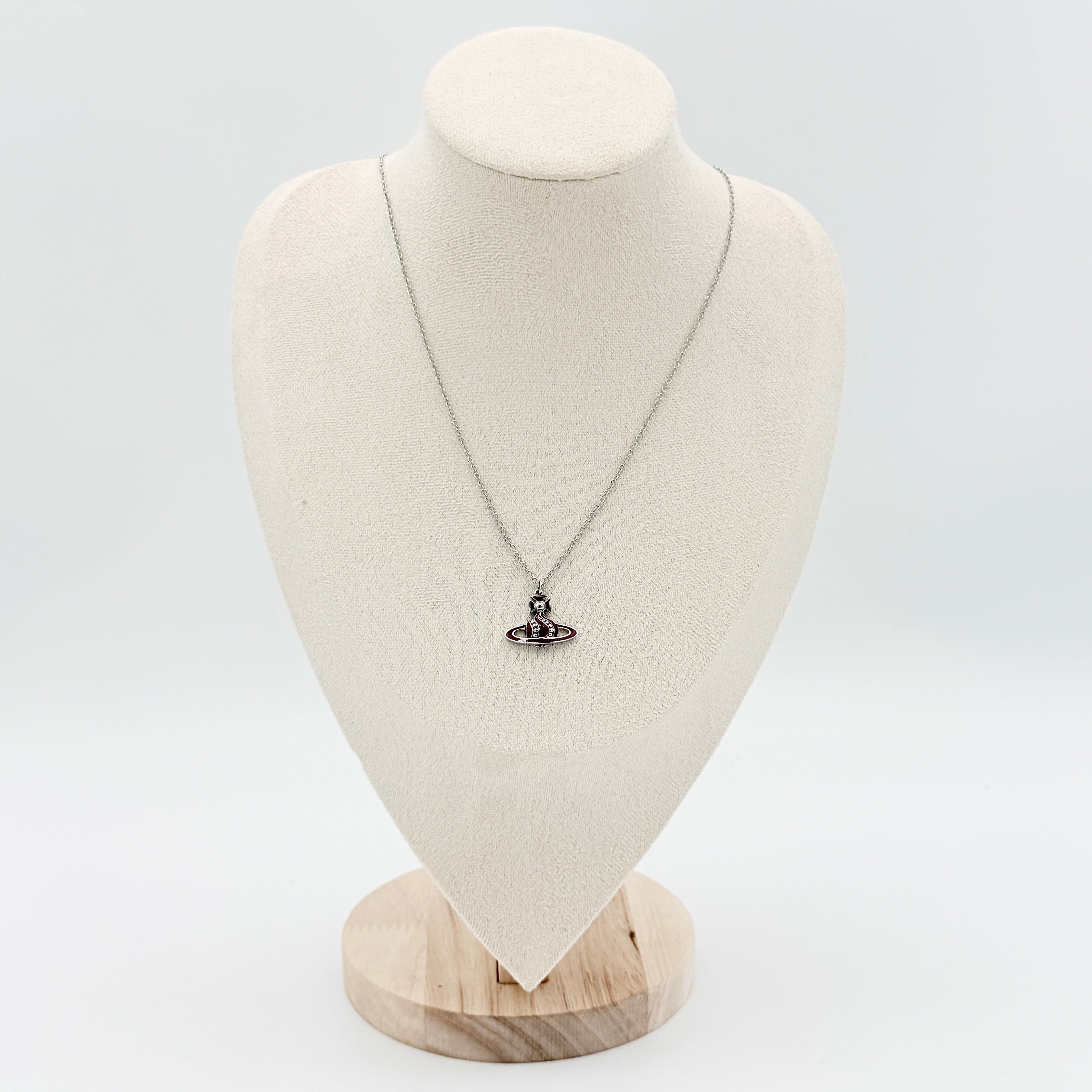 Vivienne Westwood Orb Enamel Necklace in burgundy and silver, featuring the signature orb pendant on a fine chain.