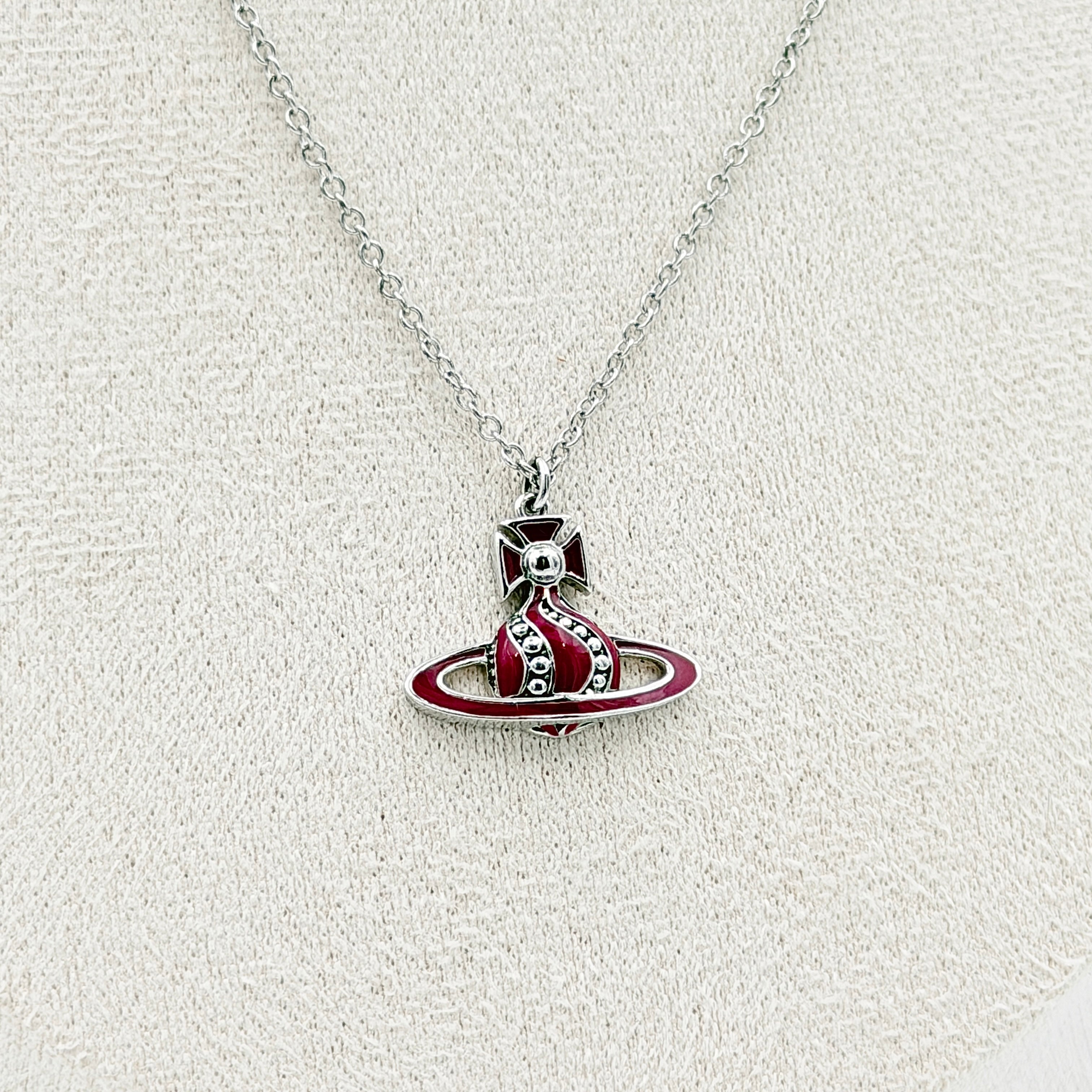 Vivienne Westwood Orb Enamel Necklace in burgundy and silver, featuring the signature orb pendant on a fine chain.