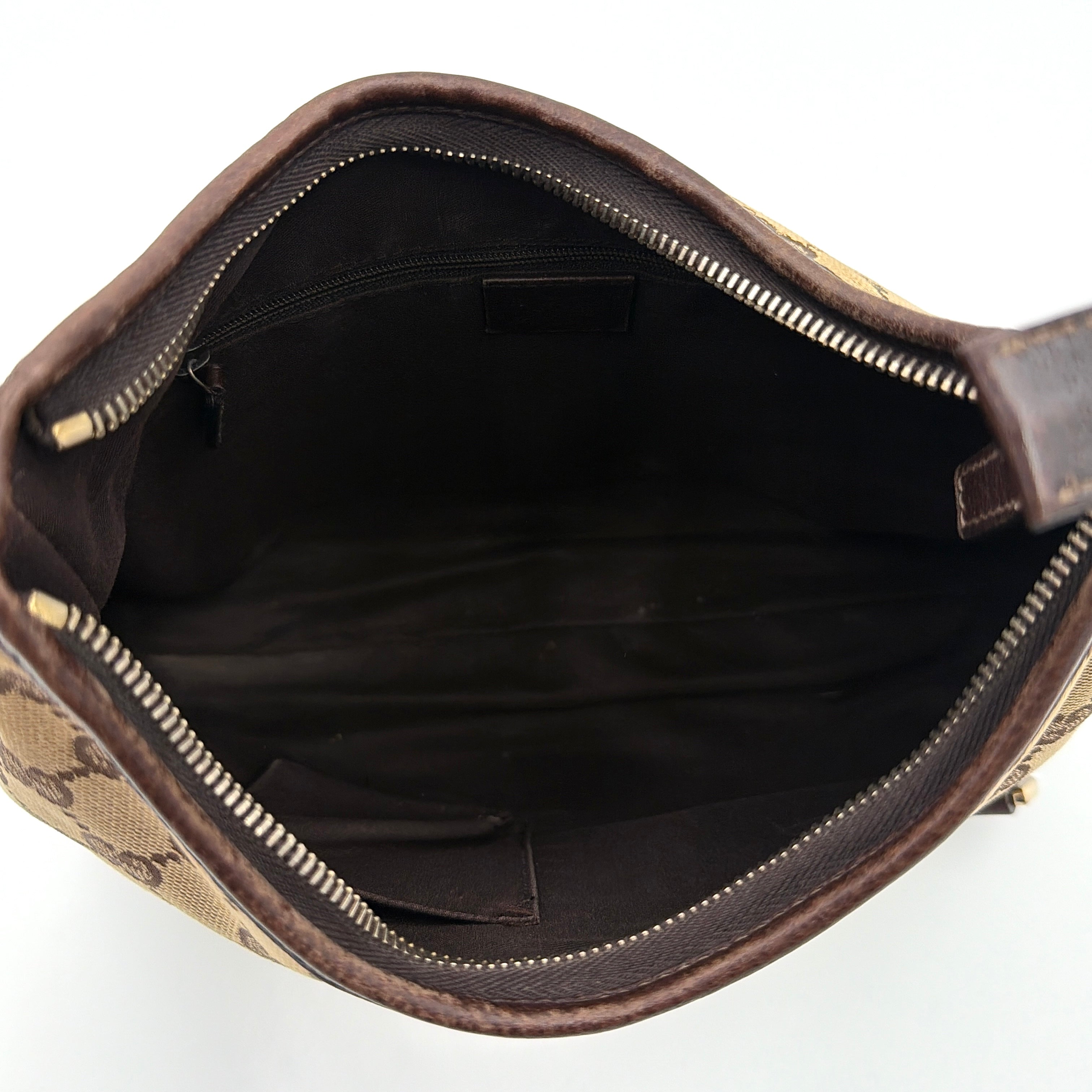 Front view of the Gucci GG Monogram Jacquard Abbey Hobo Bag in beige and brown canvas with gold-tone hardware and dark brown leather trim.