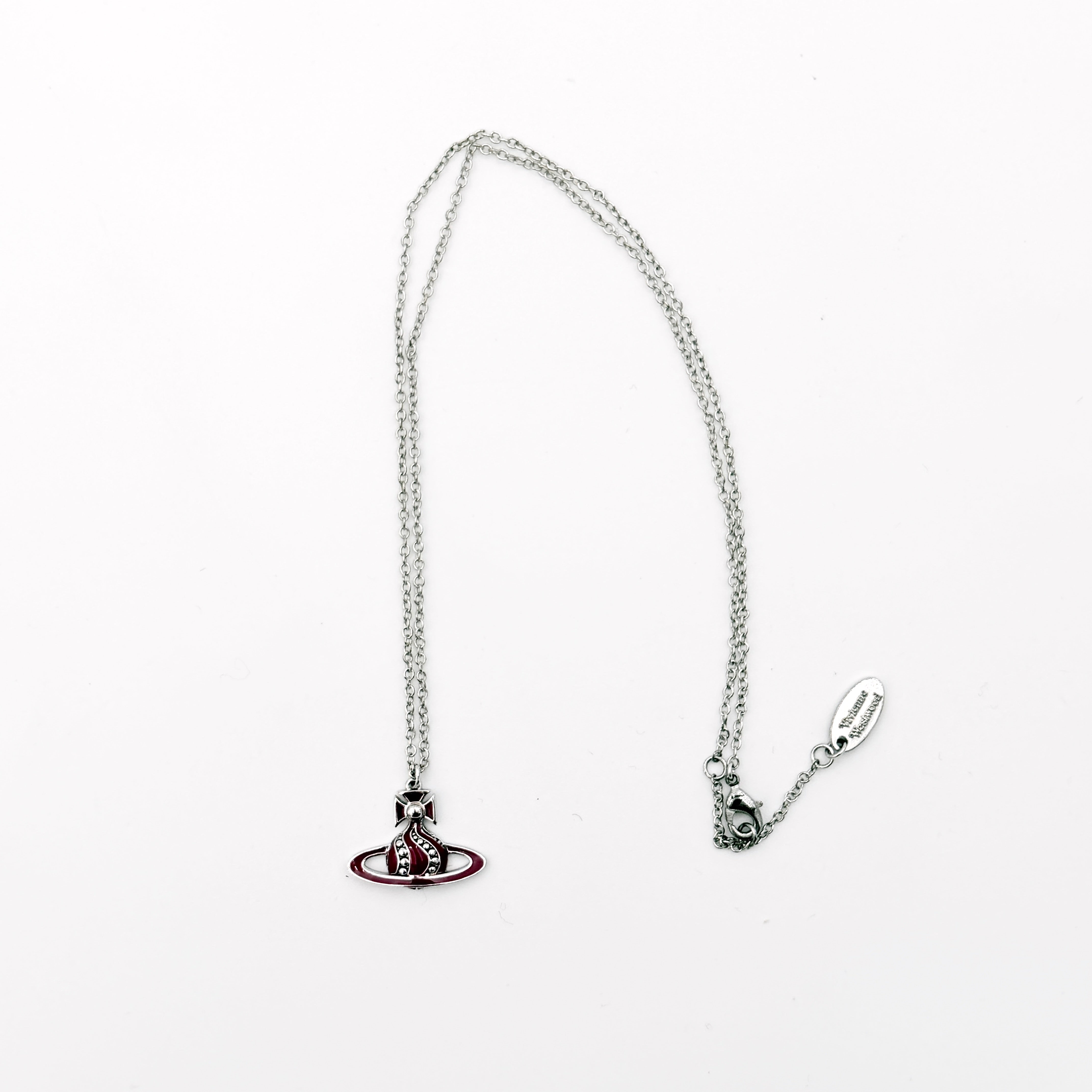 Vivienne Westwood Orb Enamel Necklace in burgundy and silver, featuring the signature orb pendant on a fine chain.