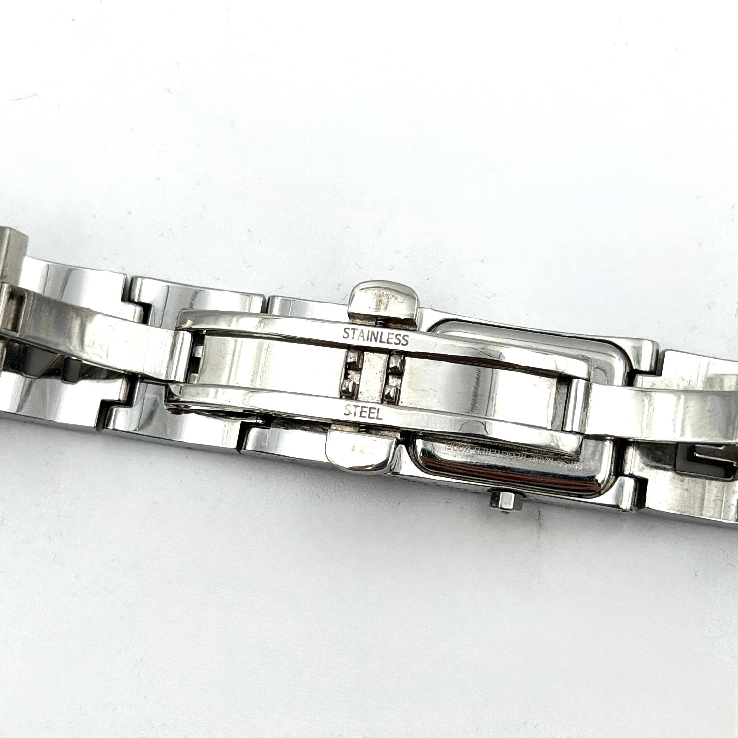 Fendi 3150L FF Logo Belt Watch in silver with a black dial, presented in a black Fendi box with gold logo accents.