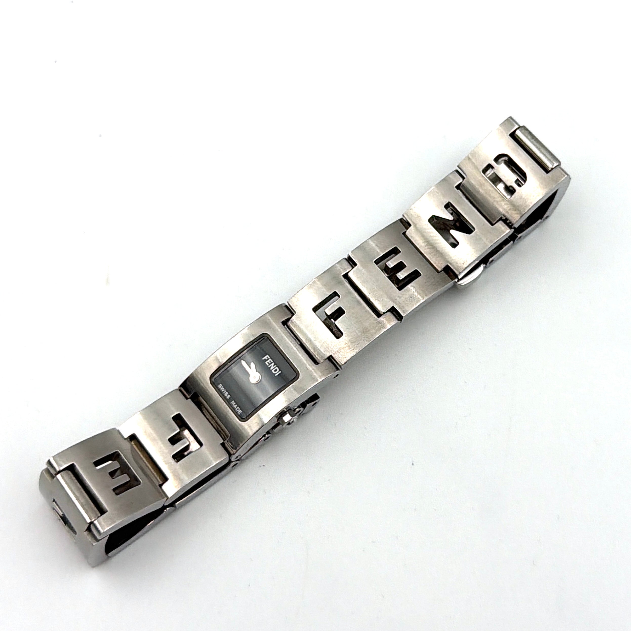 Fendi 3150L FF Logo Belt Watch in silver with a black dial, presented in a black Fendi box with gold logo accents.